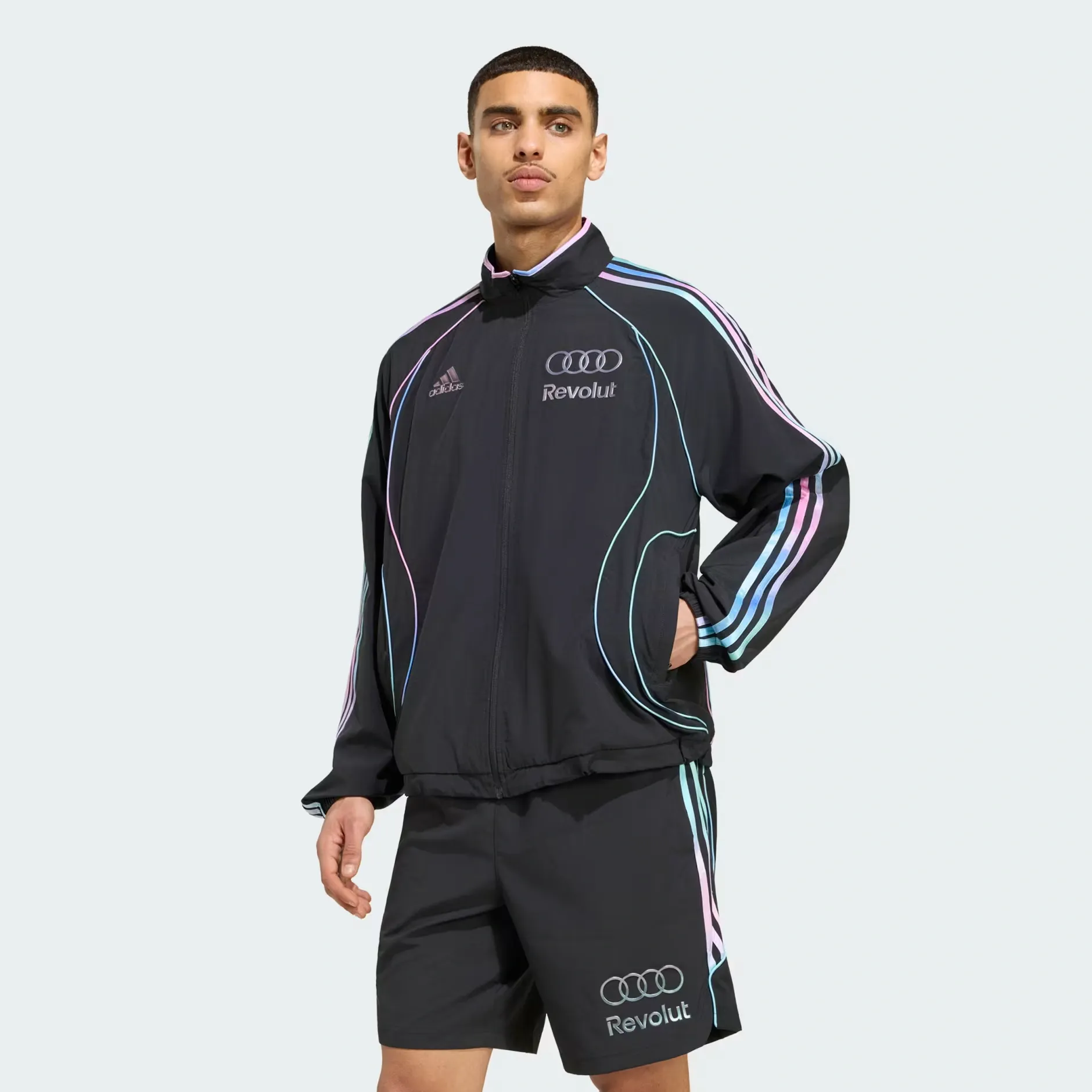 Young male model wearing adidas and Audi Revolut F1® Team Miami collection teamgeist tracktop