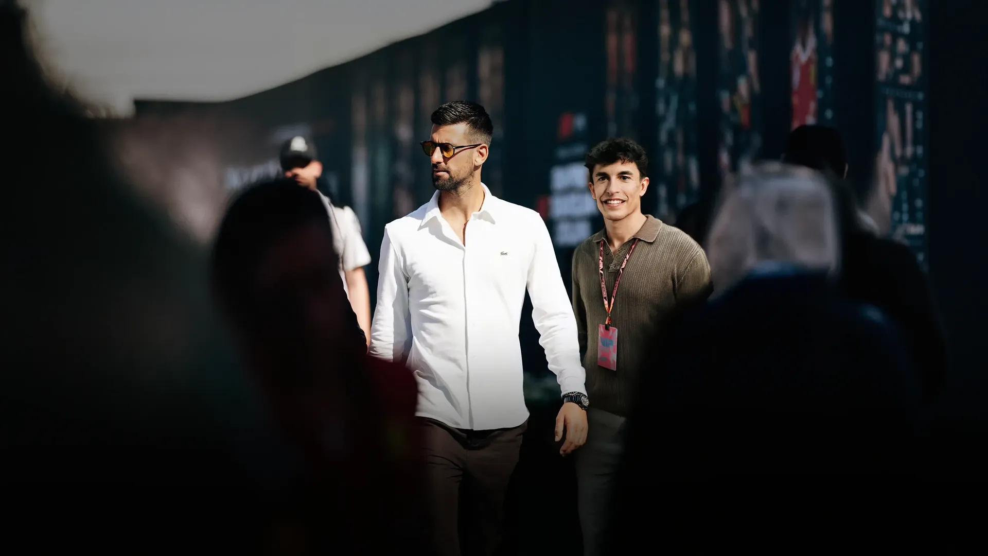 Novak Djokovic and Marc Márquez arriving at the Audi Revolut F1® Team paddock during the Barcelona Catalunya Grand Prix 2026