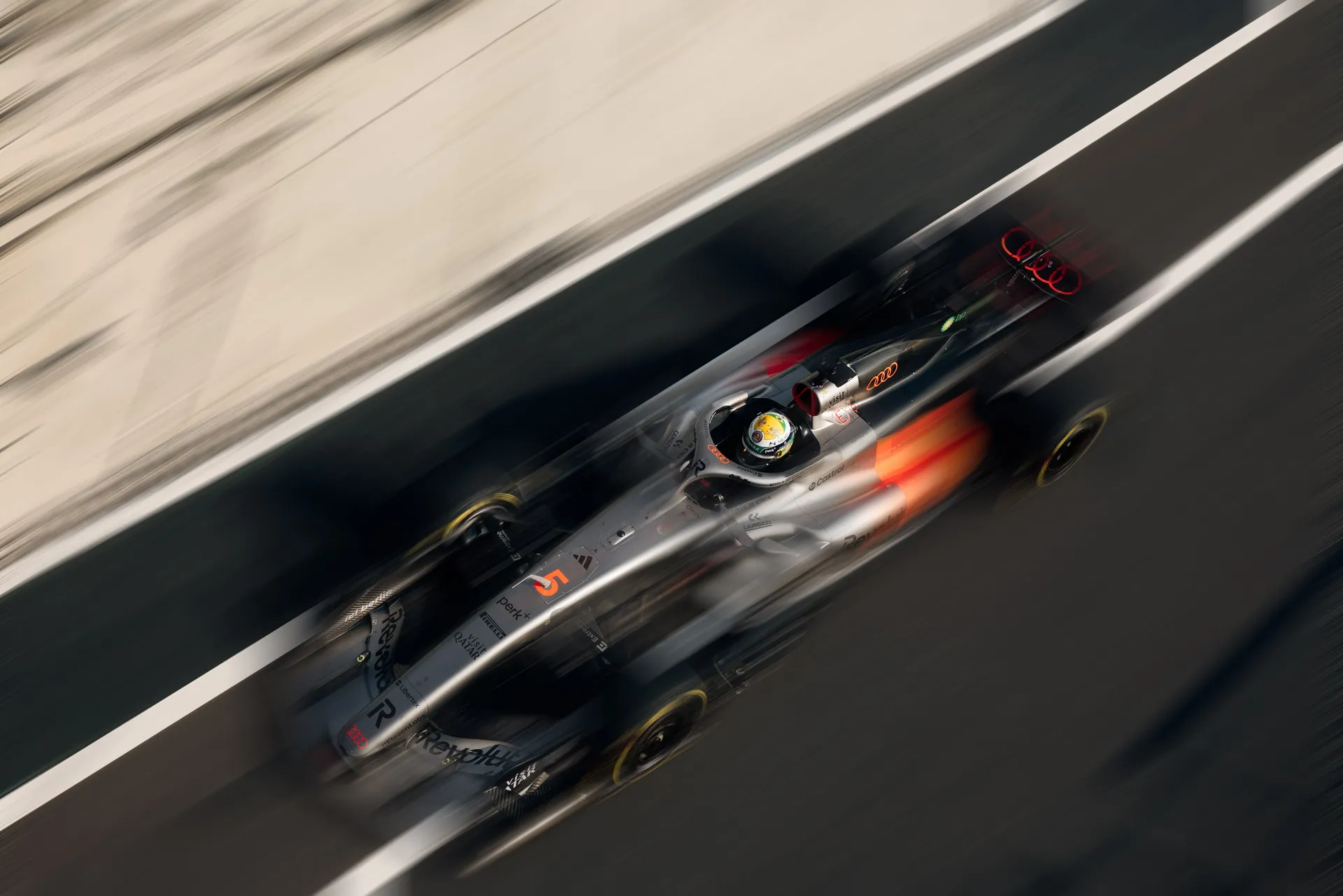 Audi Revolut F1® Team car Audi R26 viewed from above at high speed on a straight section of the Red Bull Ring.