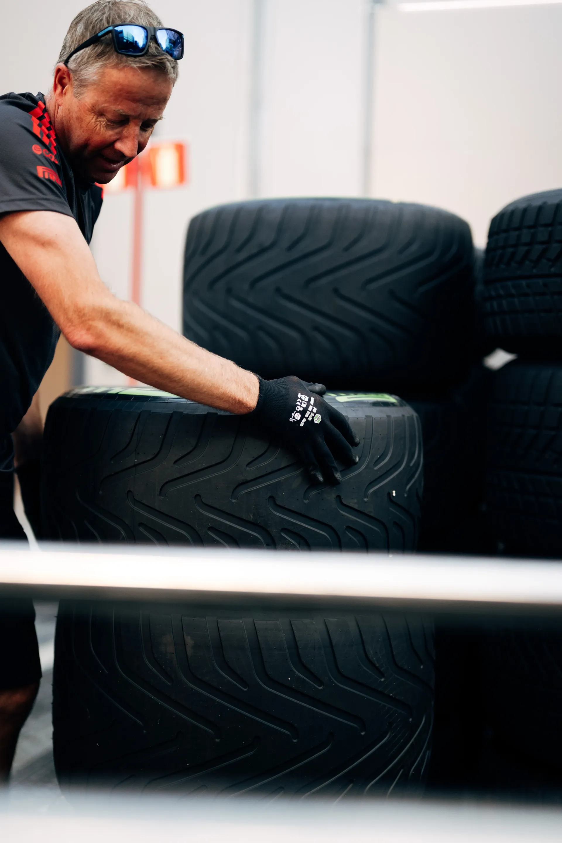 Audi Revolut F1® Team mechanic arranging racing tyres