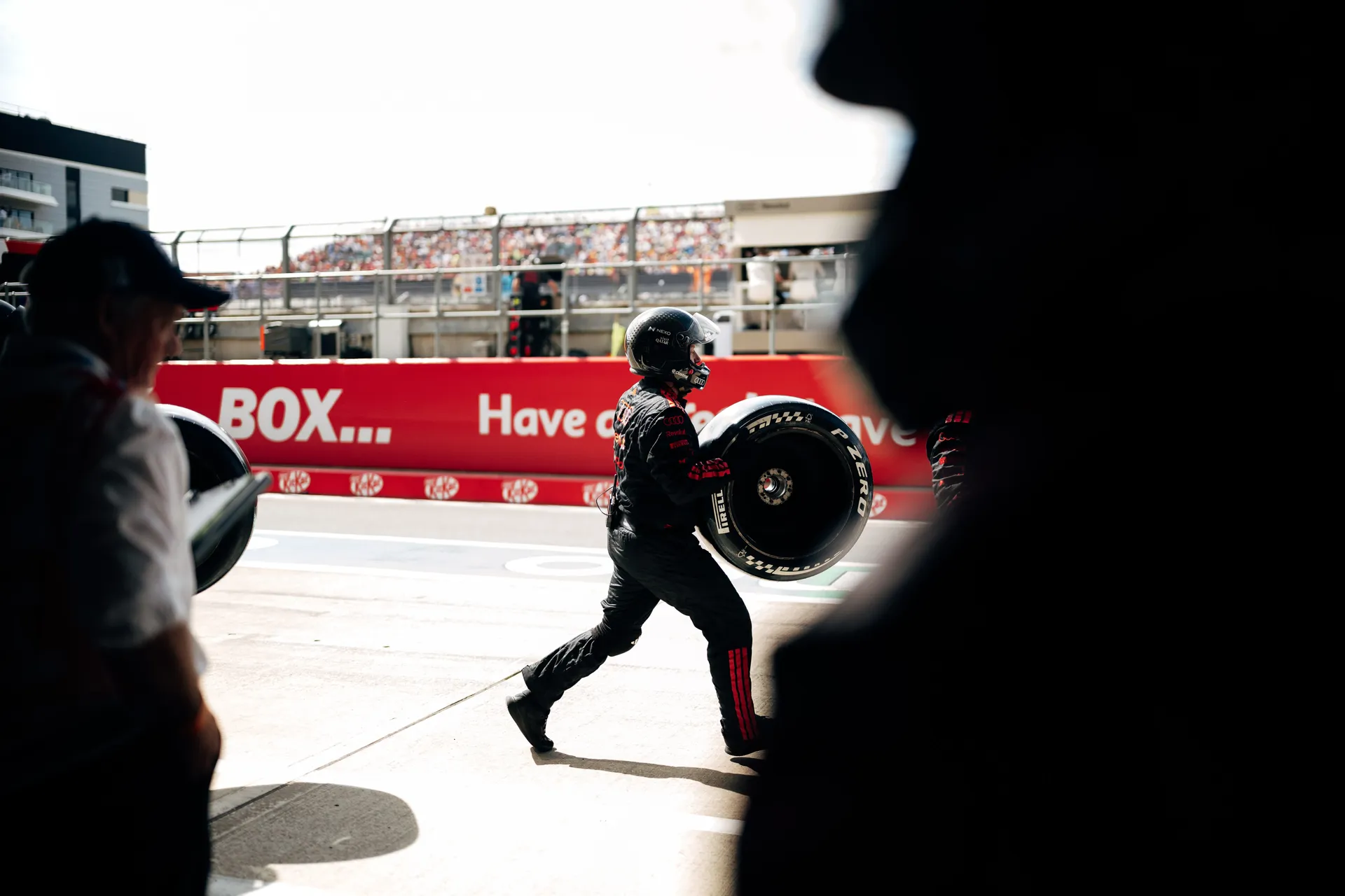Audi Revolut F1® Team crew member walking through the pit lane