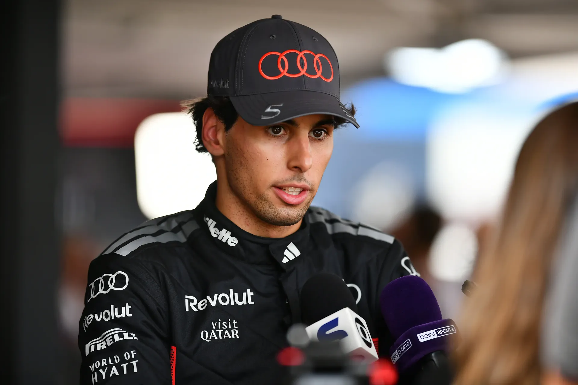 Close up of Gabriel Bortoleto driver at the Audi Revolut F1® Team giving an interview inside the team garage