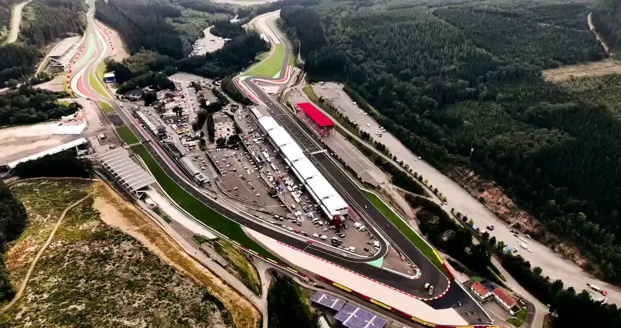 Aerial view of Circuit de Spa-Francorchamps showing the racetrack winding through forested hills.