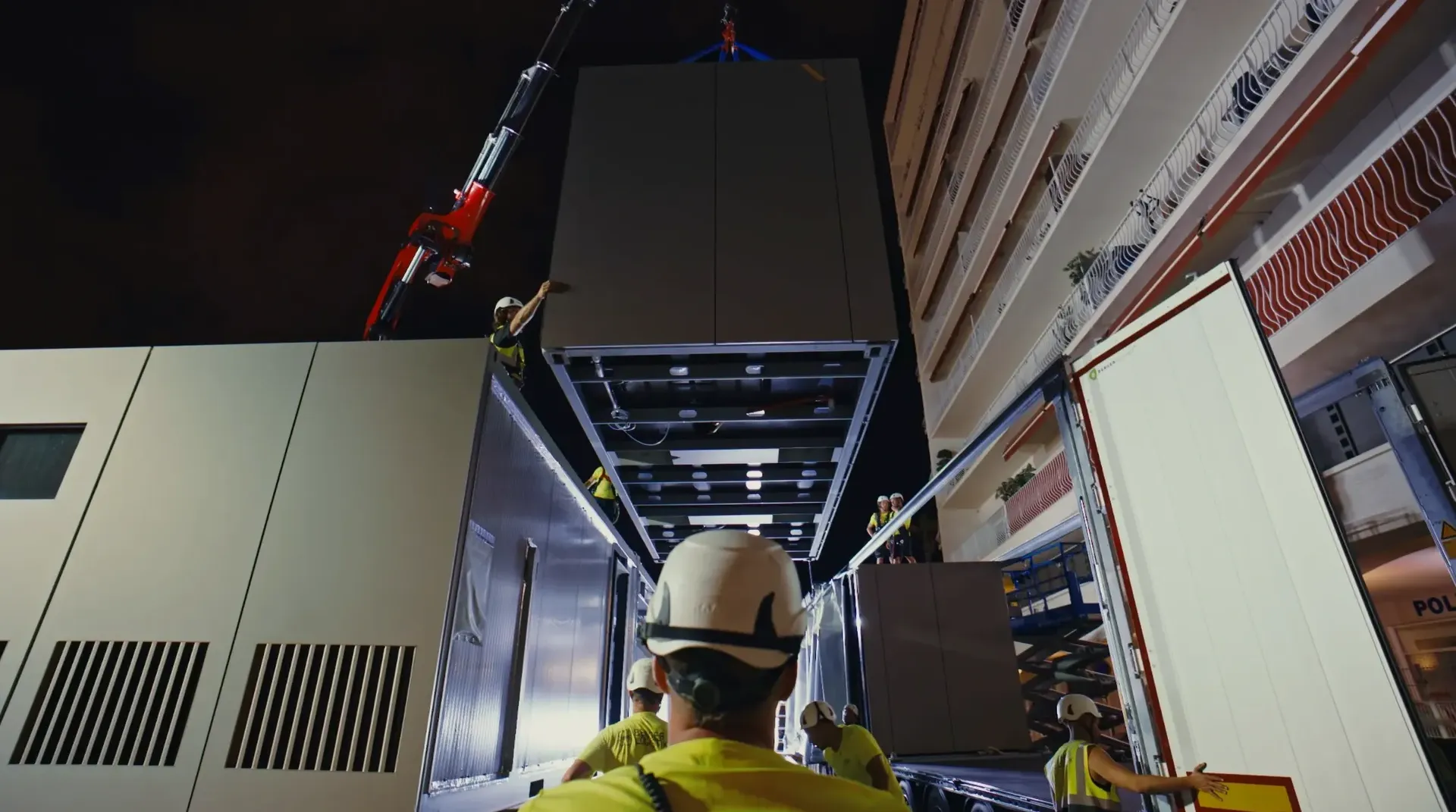 Low angle shot of Audi Revolut F1® Team trailer driving under highway bridge