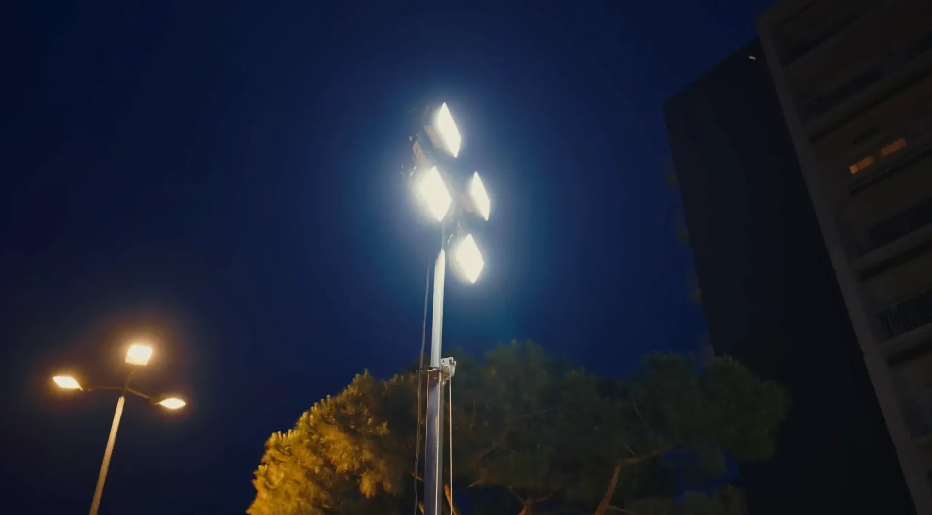 Audi Revolut F1® Team convoy driving on illuminated highway at night