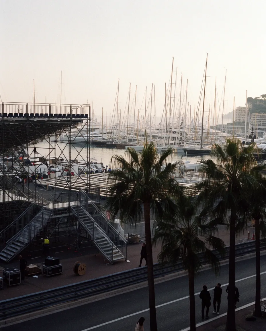 Overlooking Monaco’s marina filled with yachts and waterfront buildings.