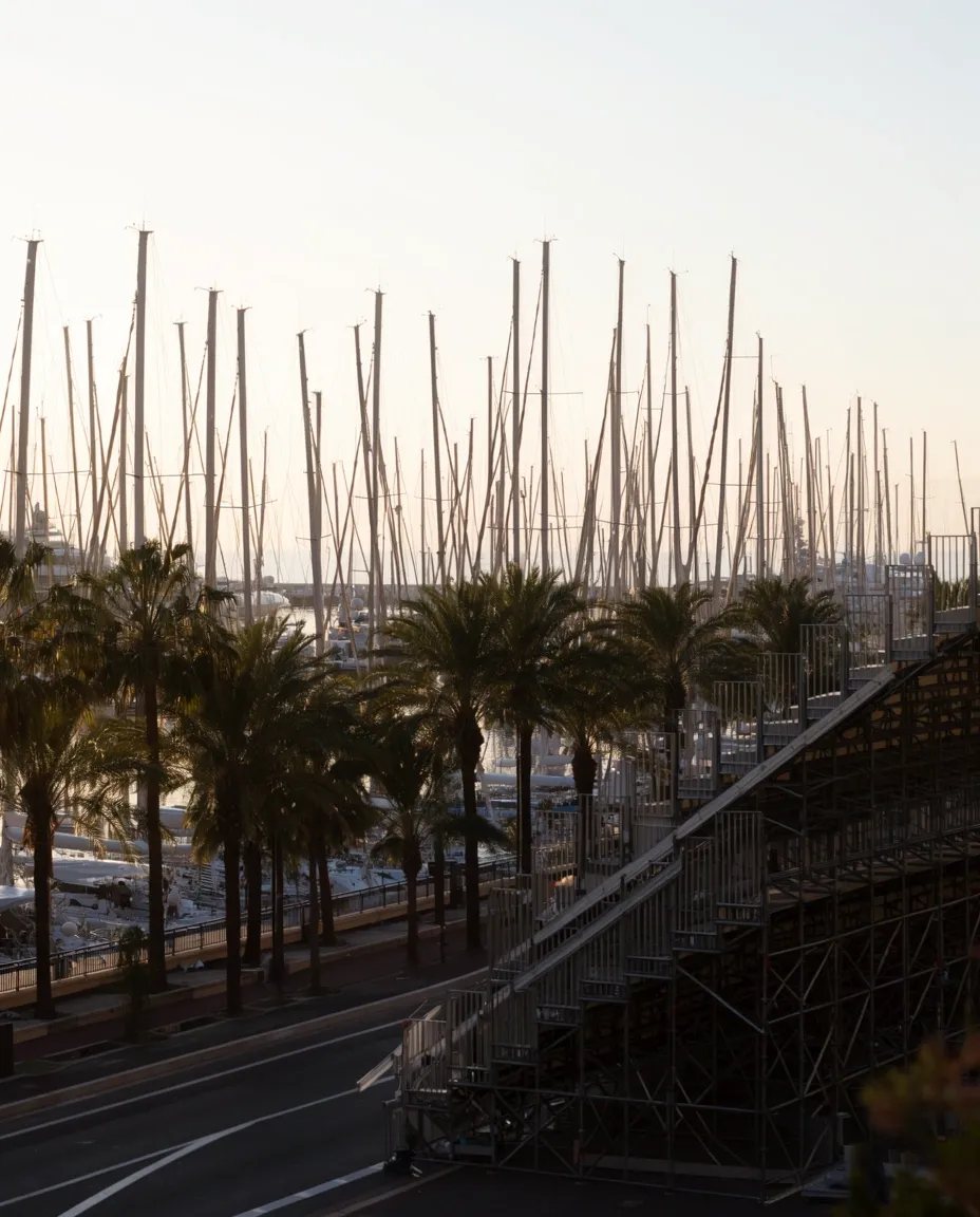 Dense cluster of yacht masts rising above Monaco’s marina district.