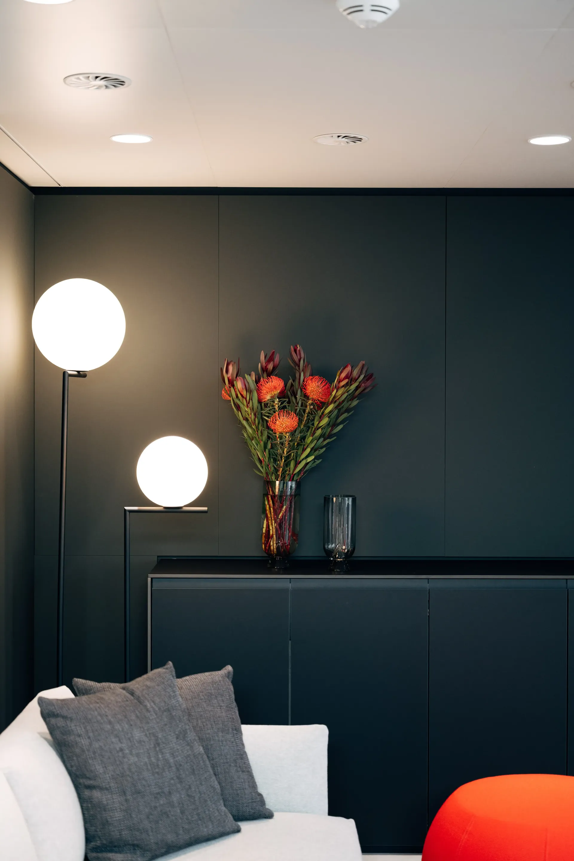 Interior wall detail within the Audi Revolut F1® Team hospitality hub featuring decorative lighting and artwork.