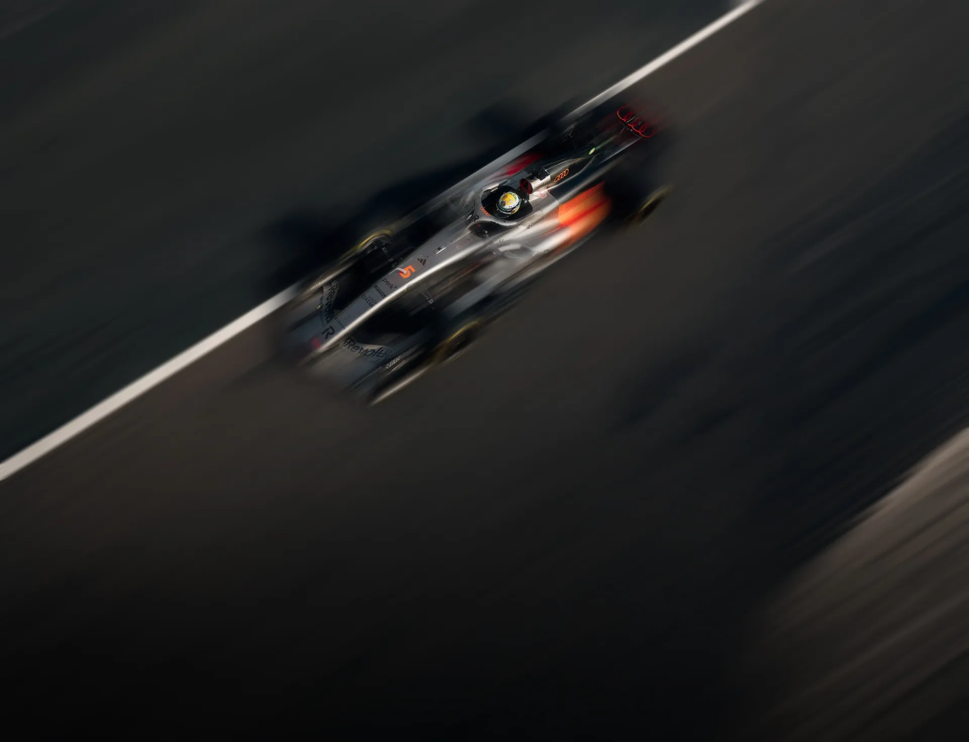 Top view of the Audi Revolut F1® Team car the Audi R26 at high speed on the race track