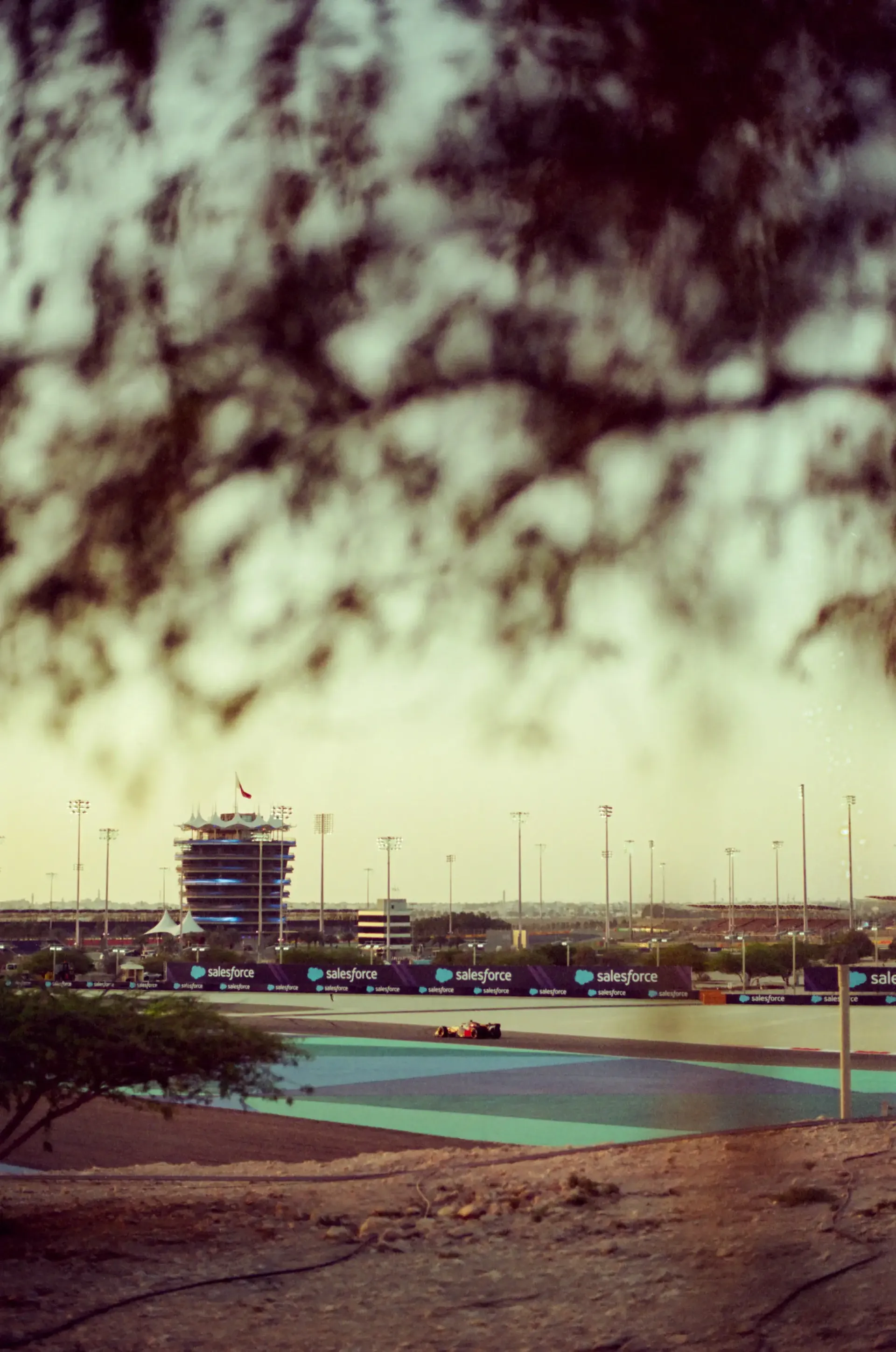 Scenic view of the Formula 1® circuit at sunset with the track and surrounding landscape in the distance.