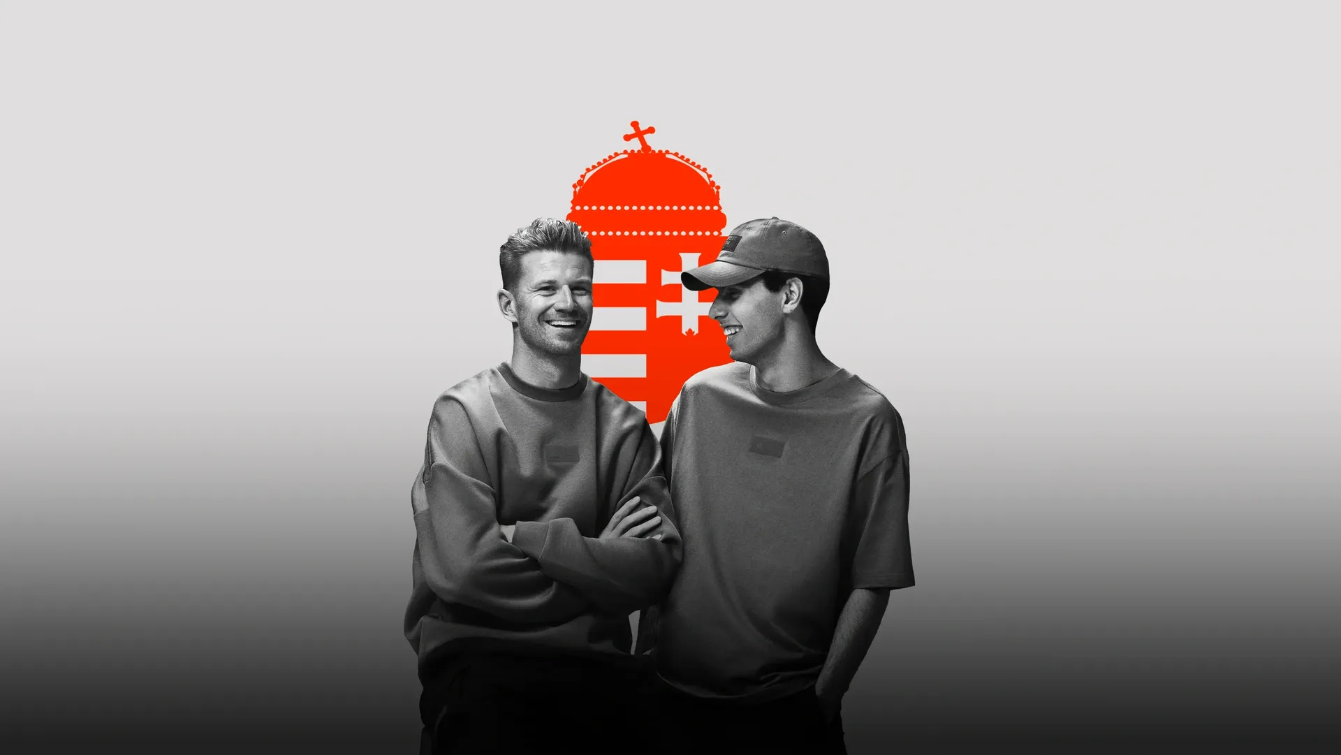 Black and white shot of Audi Revolut F1® Team drivers Nico Hulkenberg and Gabriel Bortoleto side by side in the studio wearing adidas Eleveted Fanwear Collection