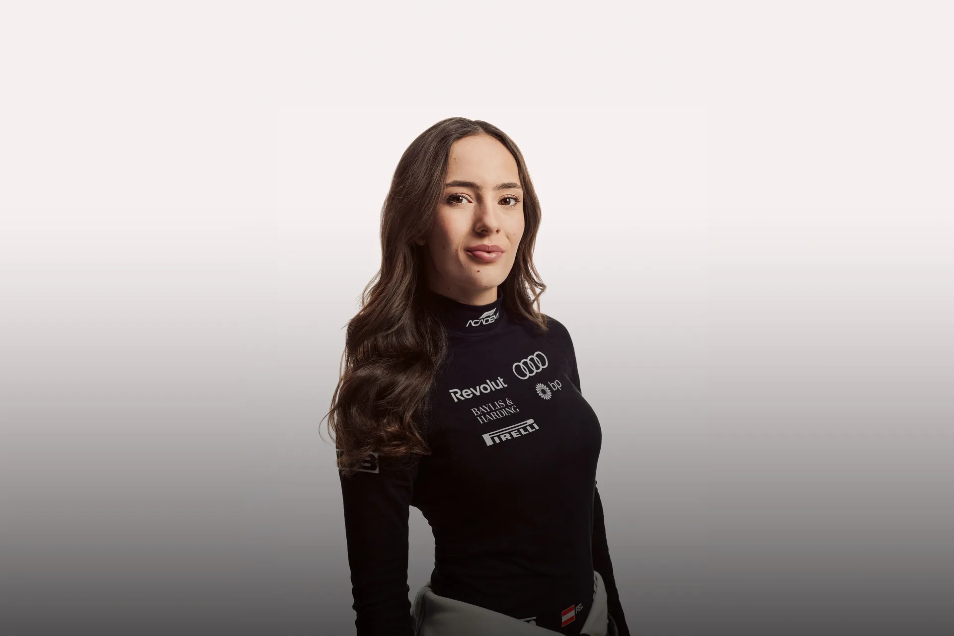 Front shot of Audi Revolut F1® Team Academy driver Emma Felbermayr in the studio