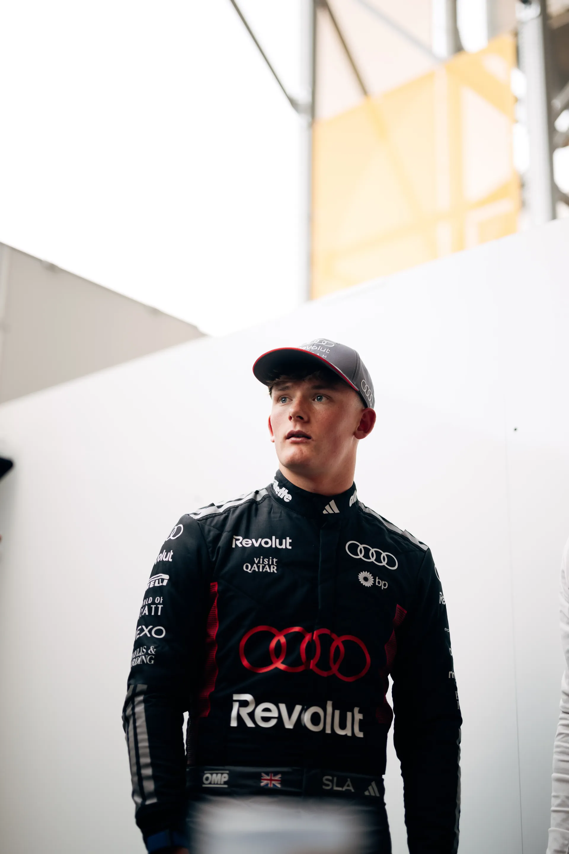 Freddie Slater of the Audi Driver Development Programme in an Audi Revolut F1® Team race suit and cap