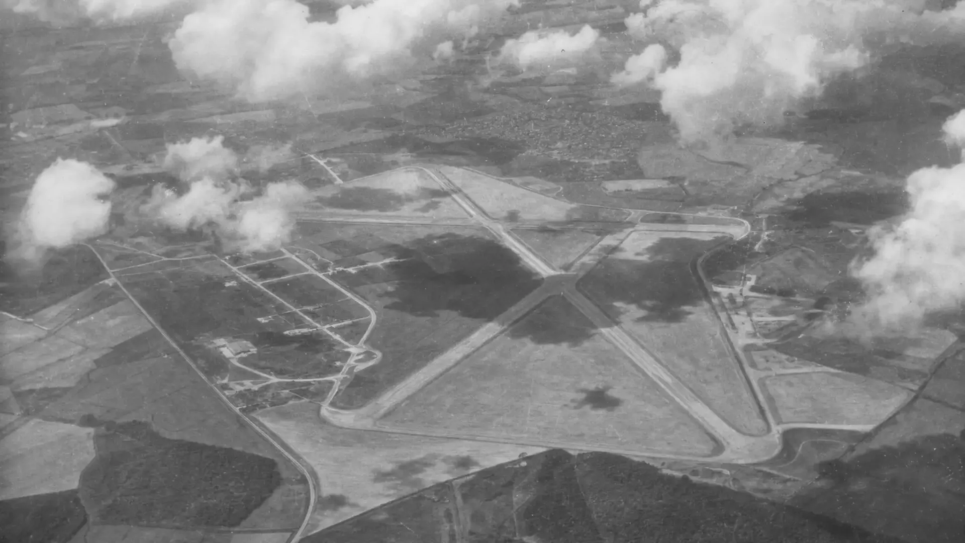 Historic aerial black-and-white photograph showing the former RAF airfield layout at Silverstone.