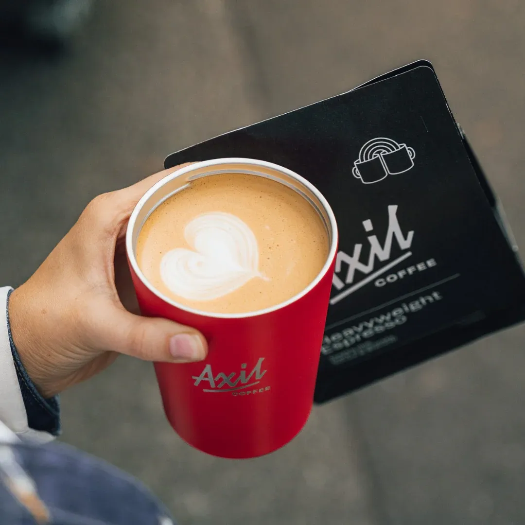 Close up of a red coffee mug showing Axils Logo Melbourne Australia