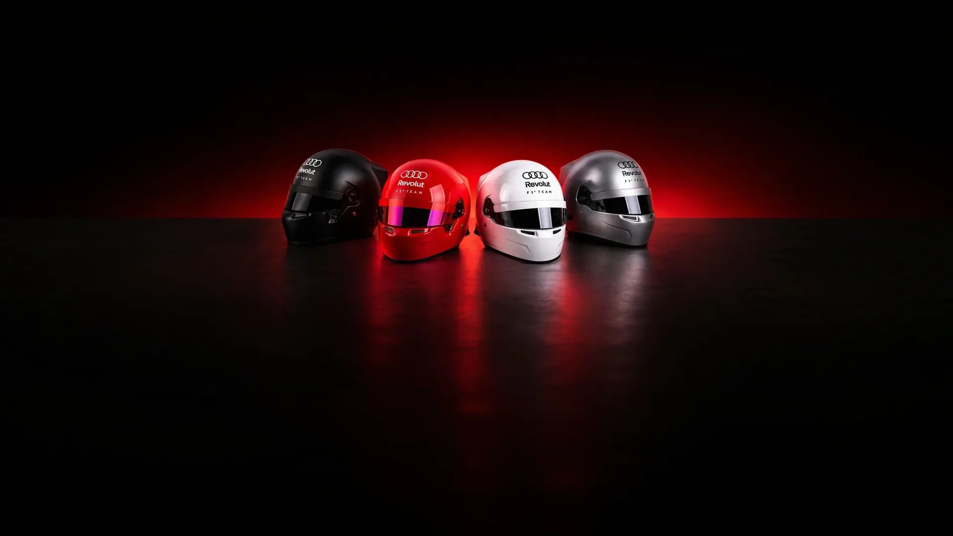 Audi Revolut F1® Team pantone helmets in red dramatic studio light
