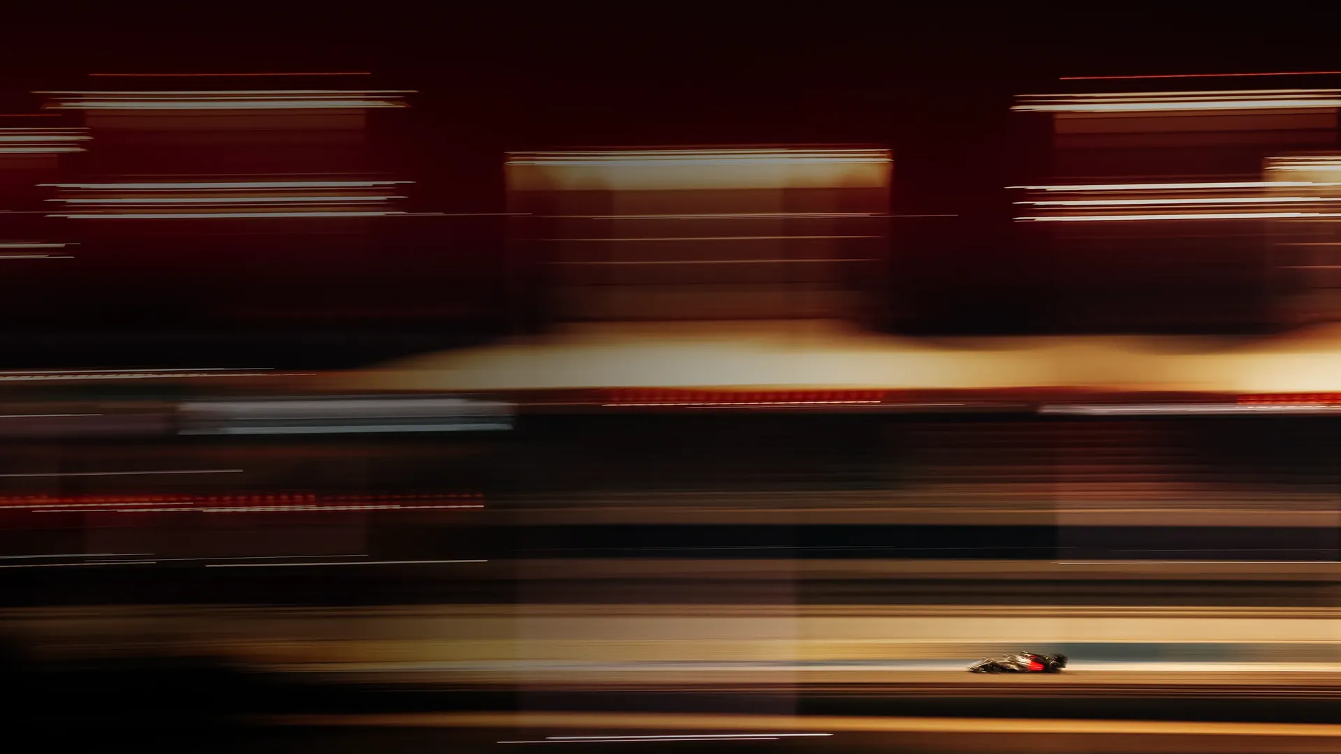 Sideview of the Audi Revolut F1® Team car driving fast on racetrack