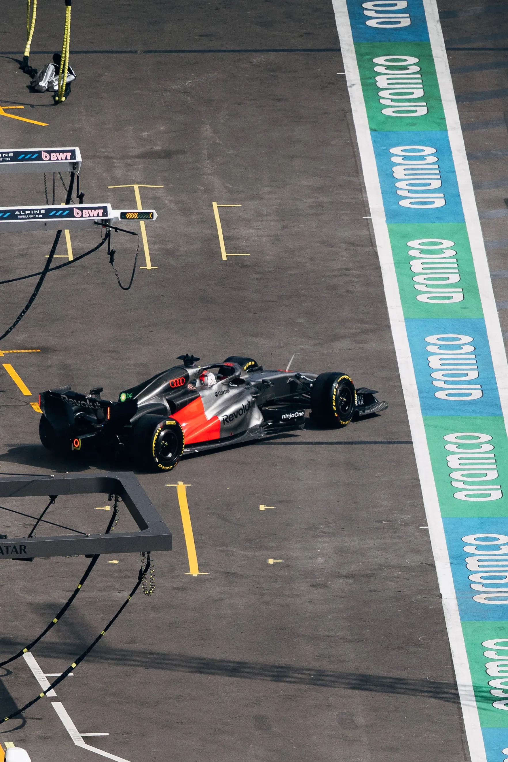 Audi R26 driving through the pit lane