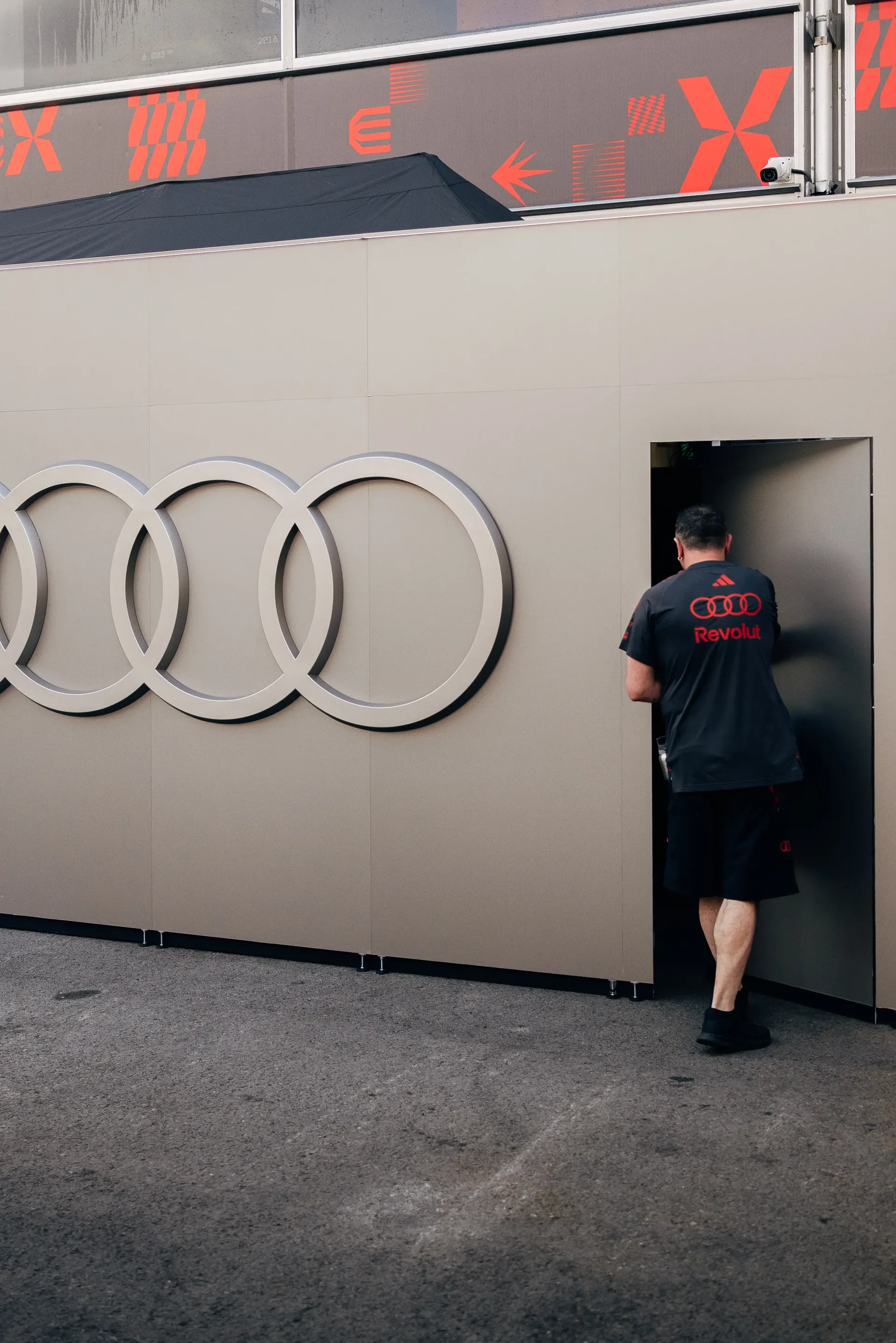 Audi Revolut F1® Team team member walking through the garage