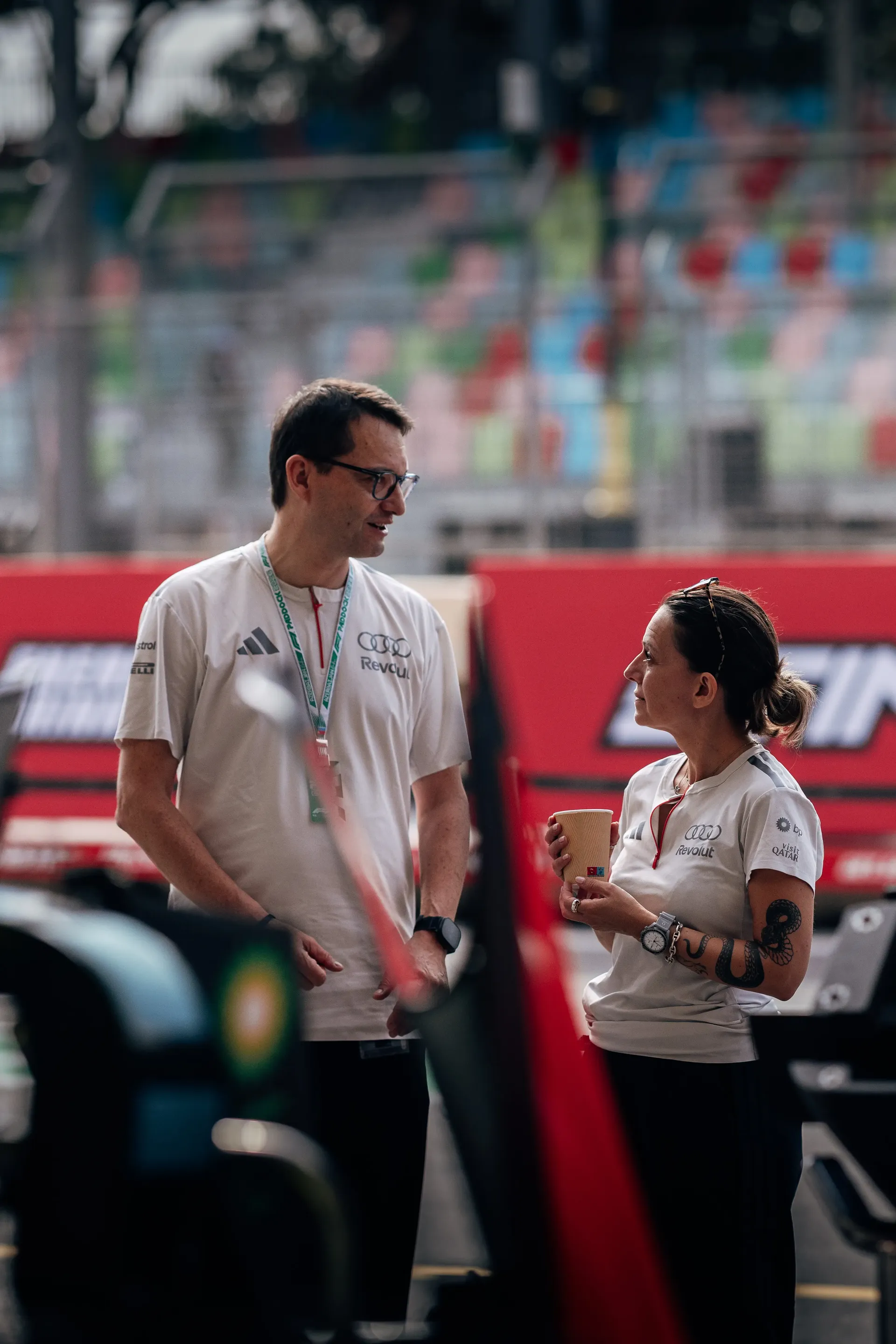 Audi Revolut F1® Team engineers talking in the paddock