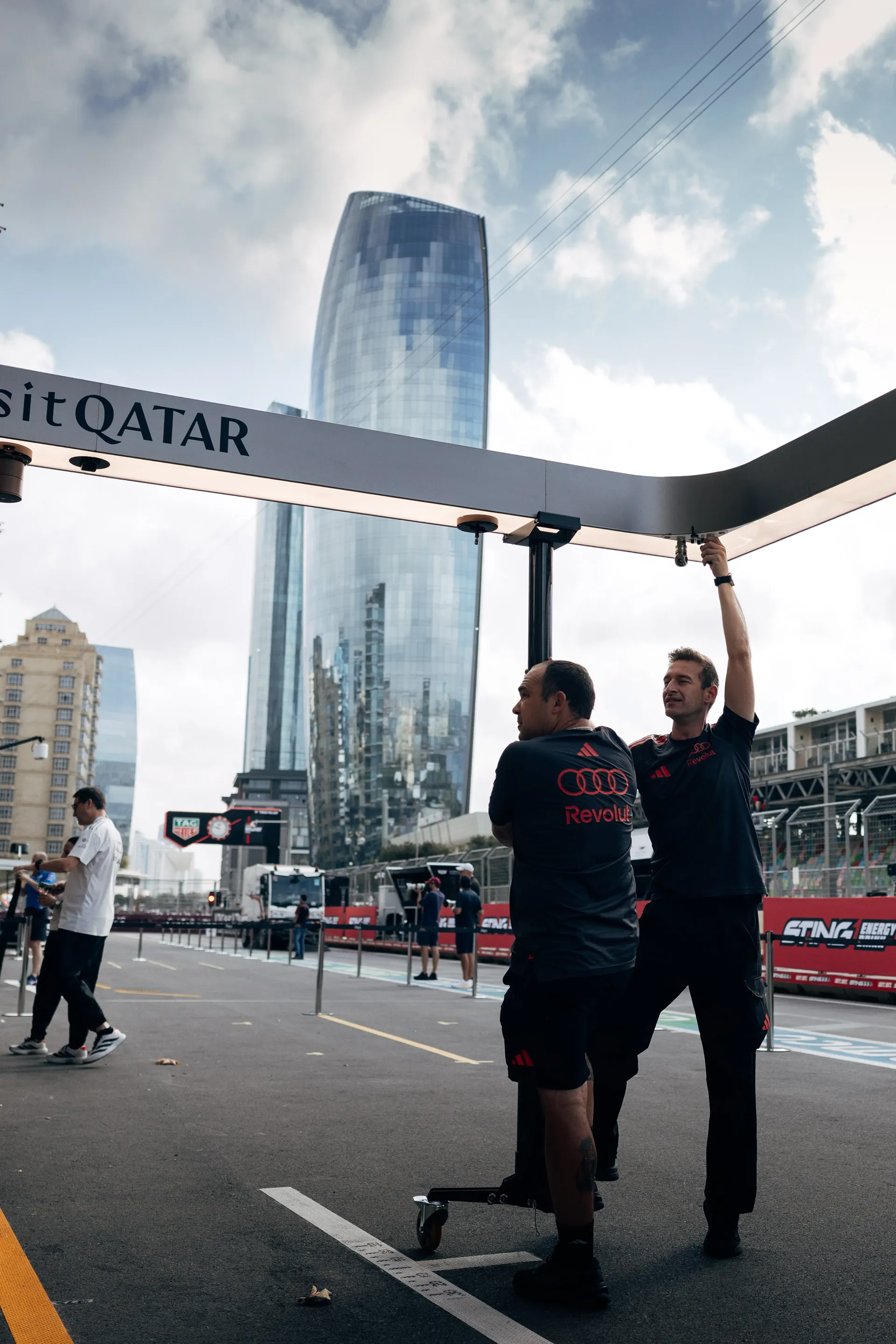 Audi Revolut F1® Team mechanics walking through the paddock in Baku