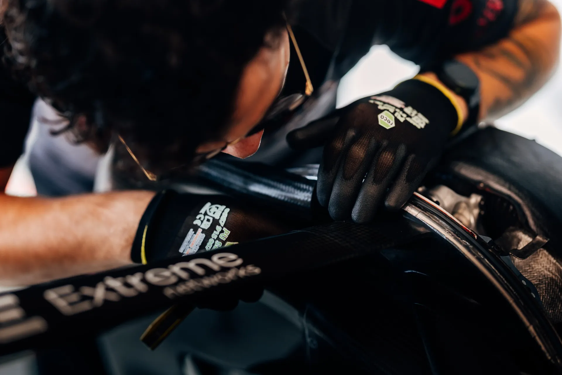 Close up of Audi Revolut F1® Team mechanic working on the Audi R26