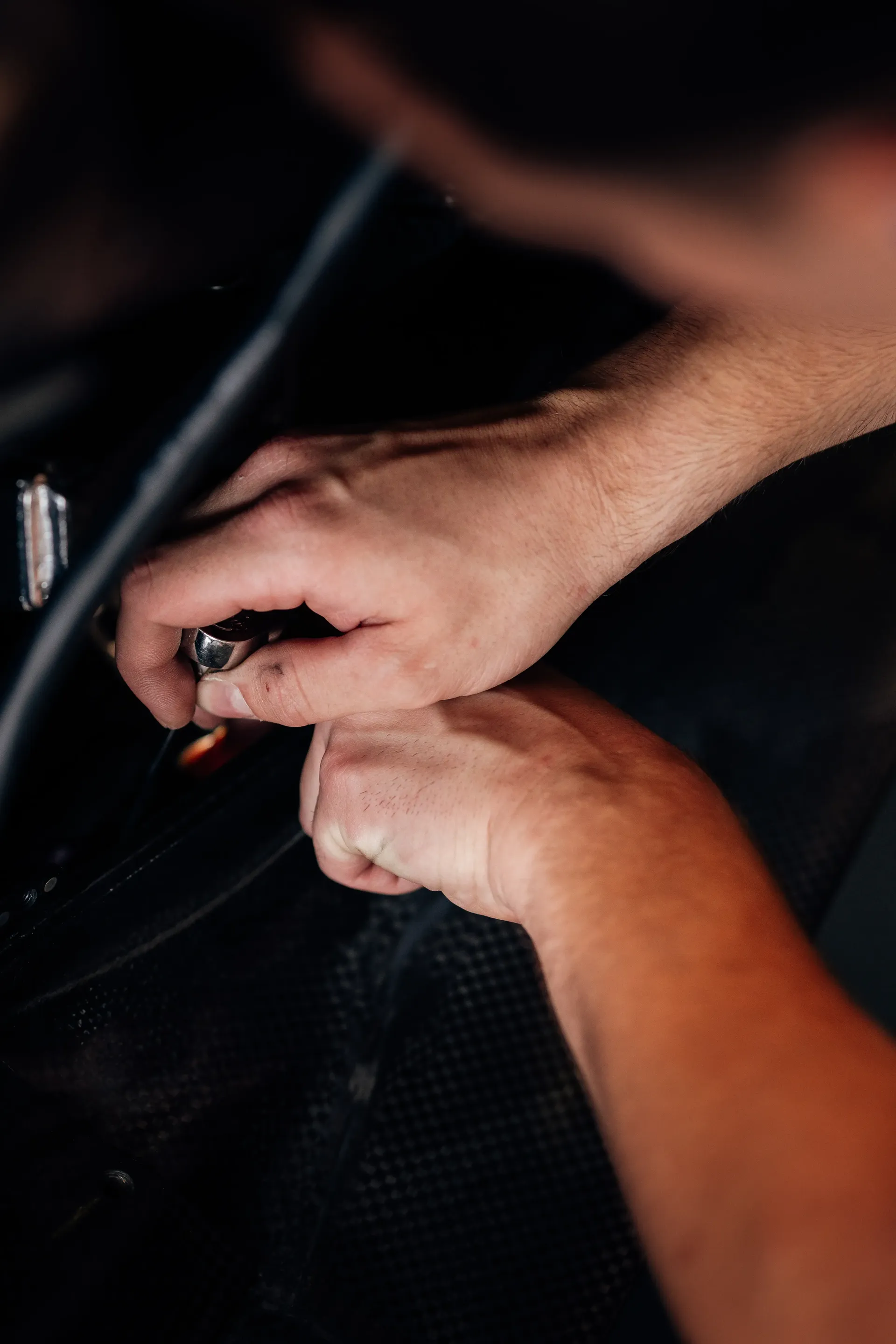 Hands Close up of an Audi Revolut F1® Team mechanic working on the Audi R26
