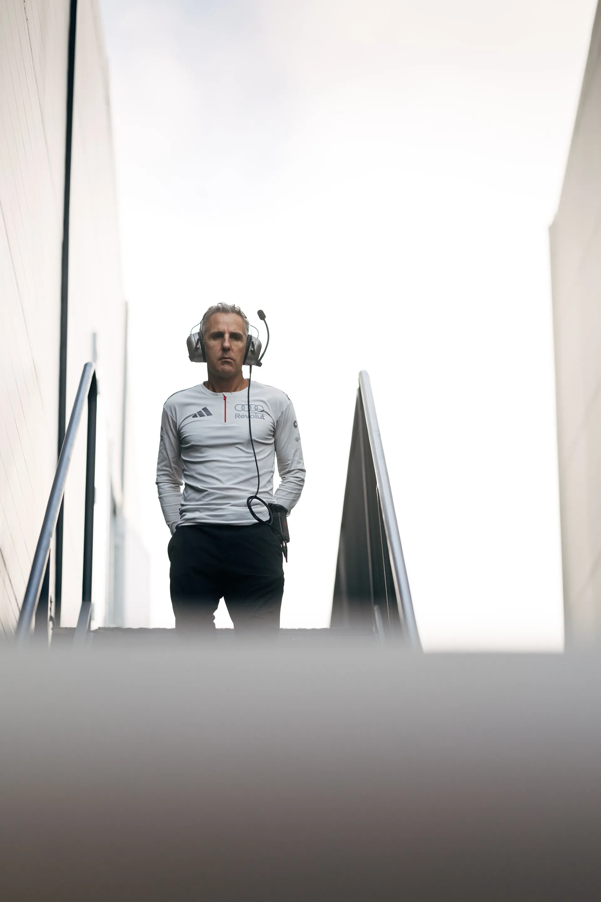 Audi Revolut F1® Team engineer standing in the paddock