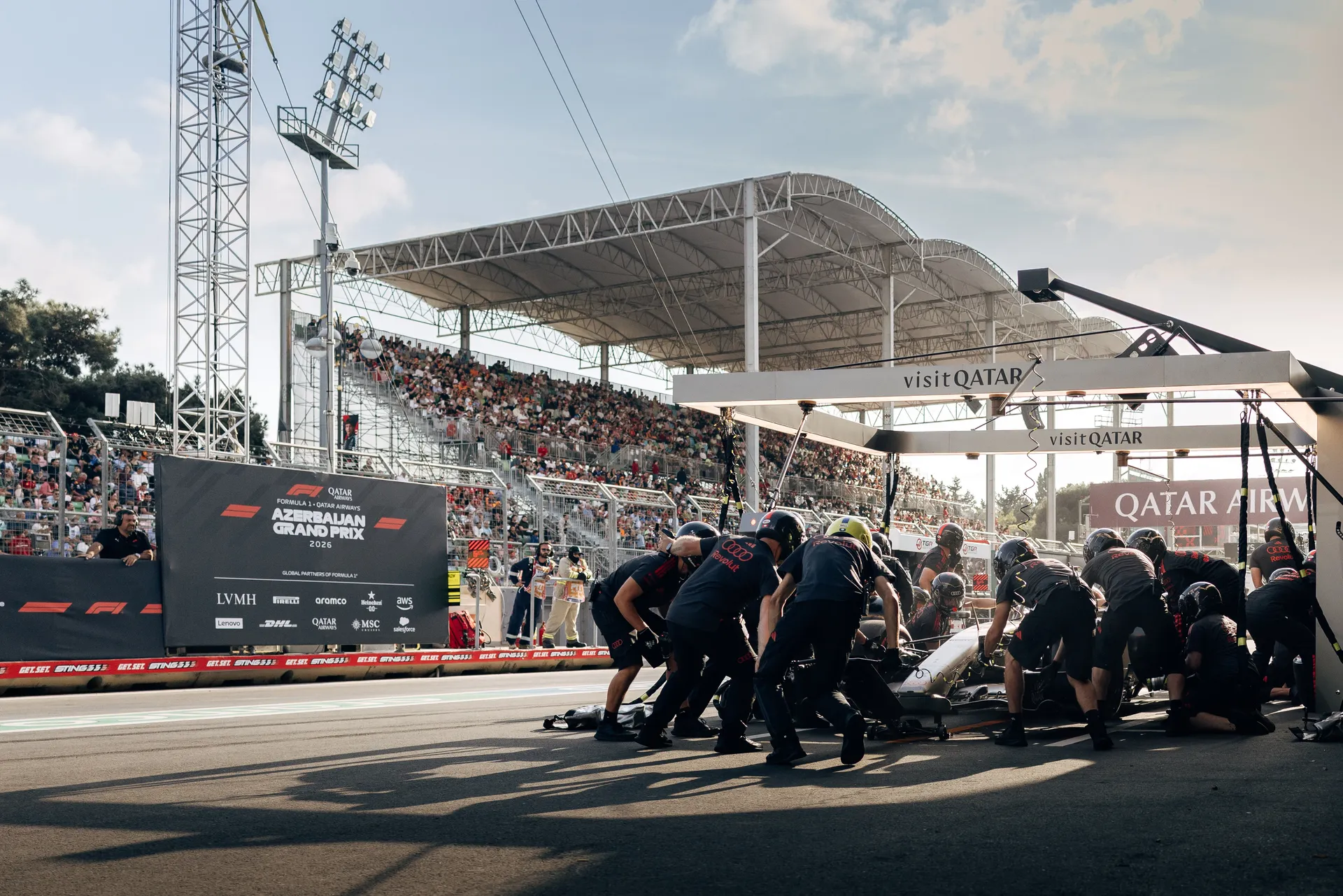 Audi Revolut F1® Team pit crew preparing in the pit lane