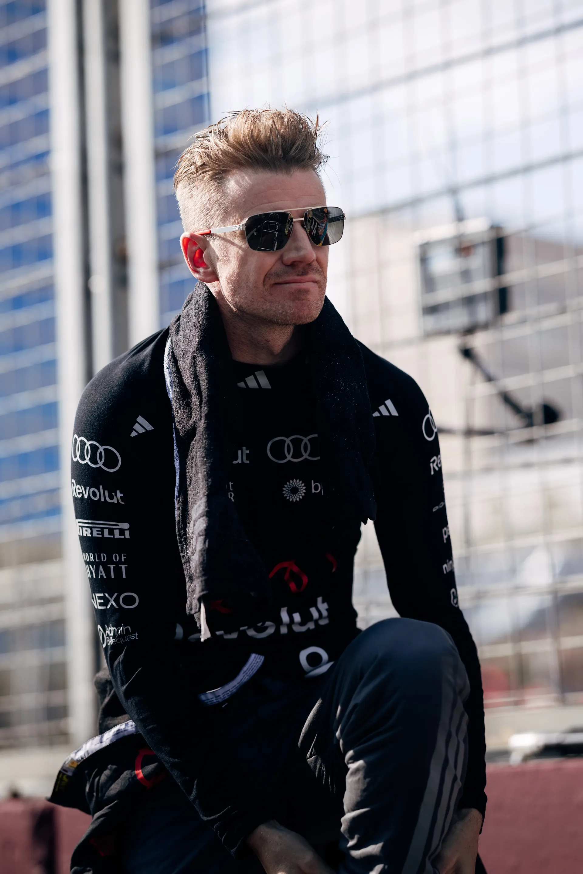 Nico Hulkenberg, driver of the Audi Revolut F1® Team, sitting in the paddock.