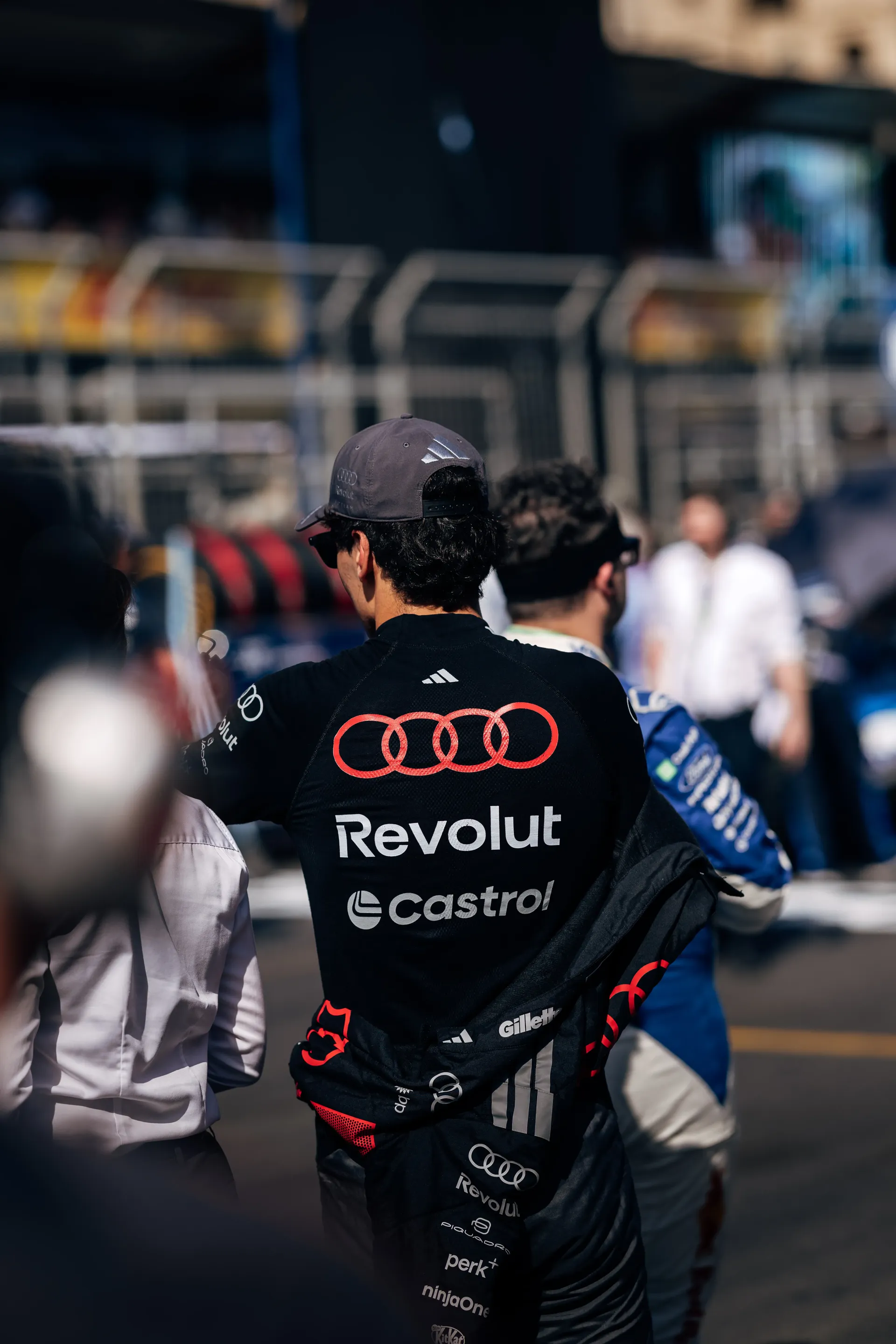 Gabriel Bortoleto, driver of the Audi Revolut F1® Team, walking through the paddock.