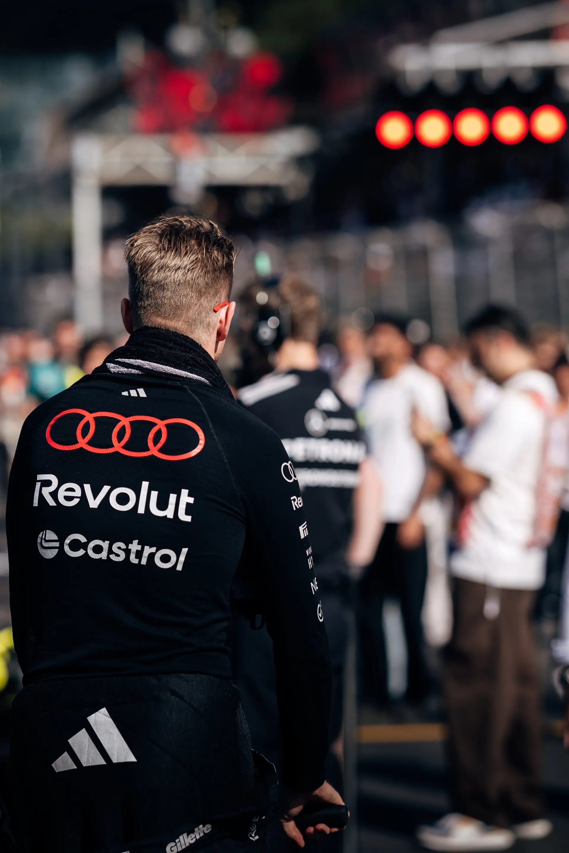 Nico Hulkenberg, driver of the Audi Revolut F1® Team, walking through the paddock.