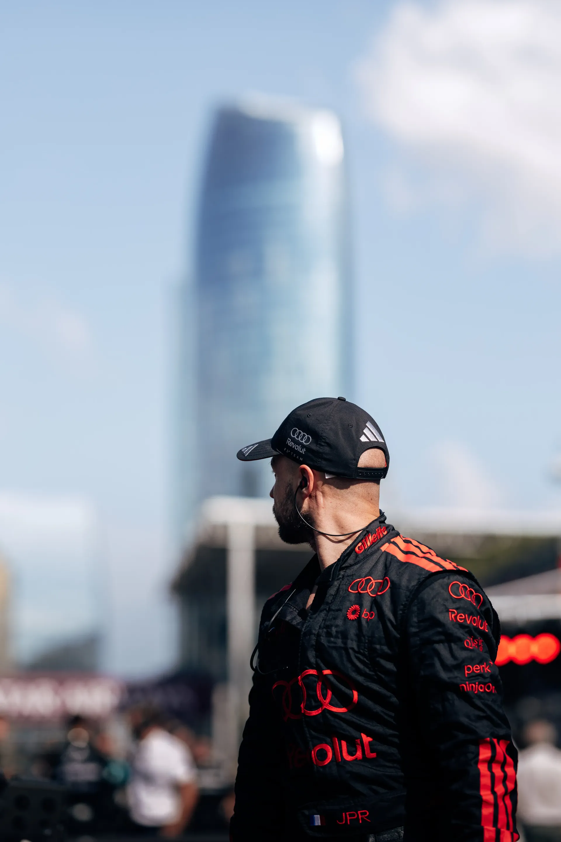 Audi Revolut F1® Team mechanic walking in the pit lane.