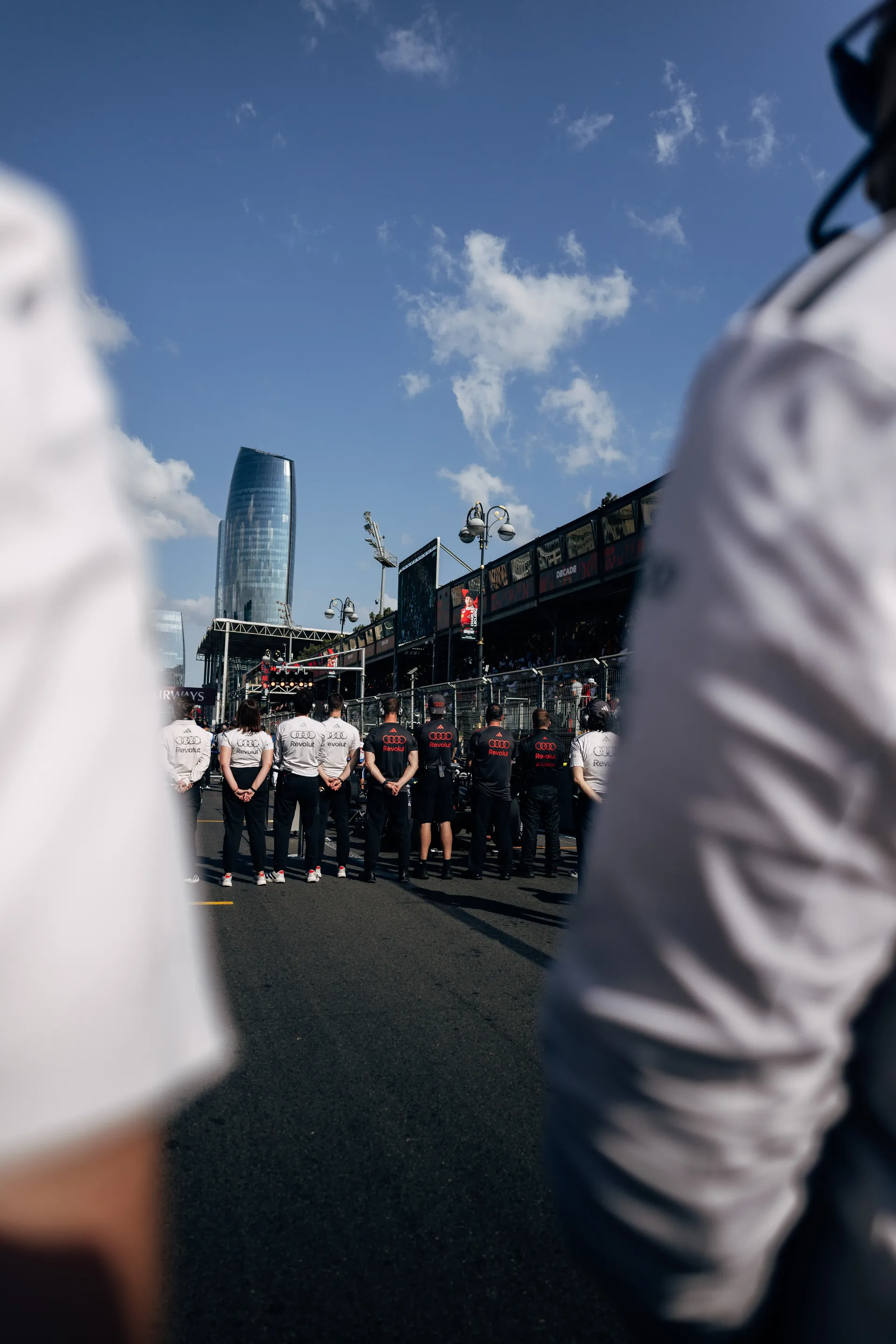 Audi Revolut F1® Team crew engineers in the pit lane.