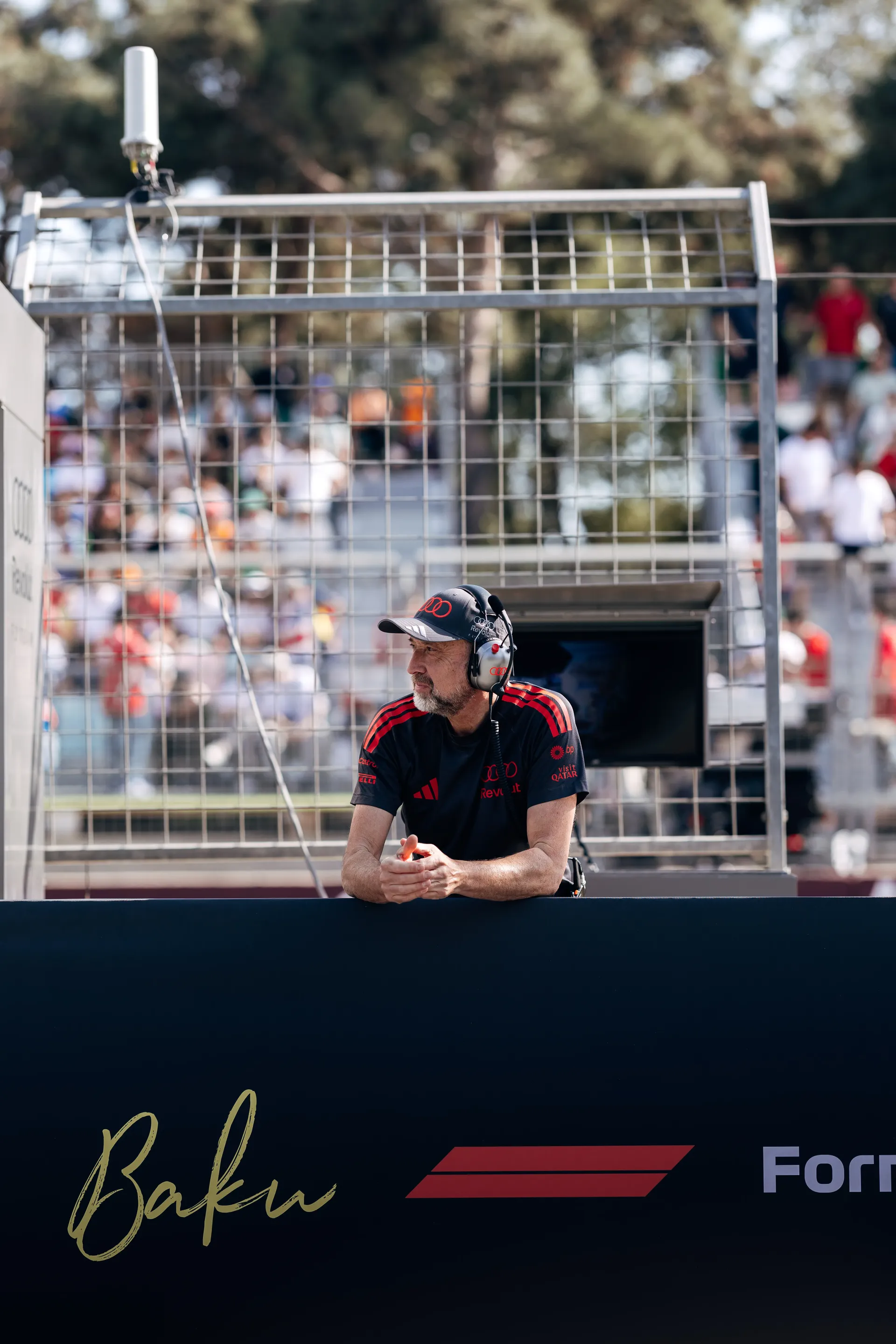 Audi Revolut F1® Team mechanic watching from the pit lane.