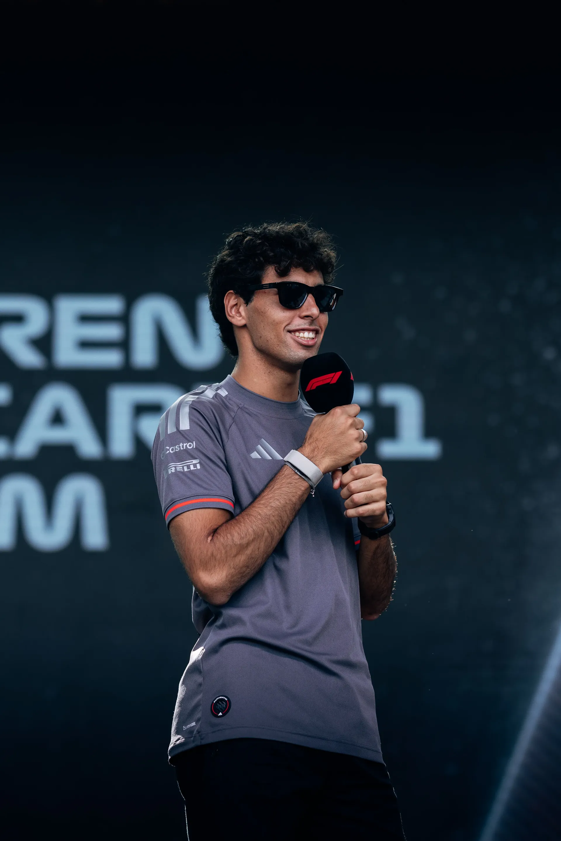 Audi Revolut F1® Team driver Gabriel Bortoleto speaking into a microphone at the Azerbaijan Grand Prix