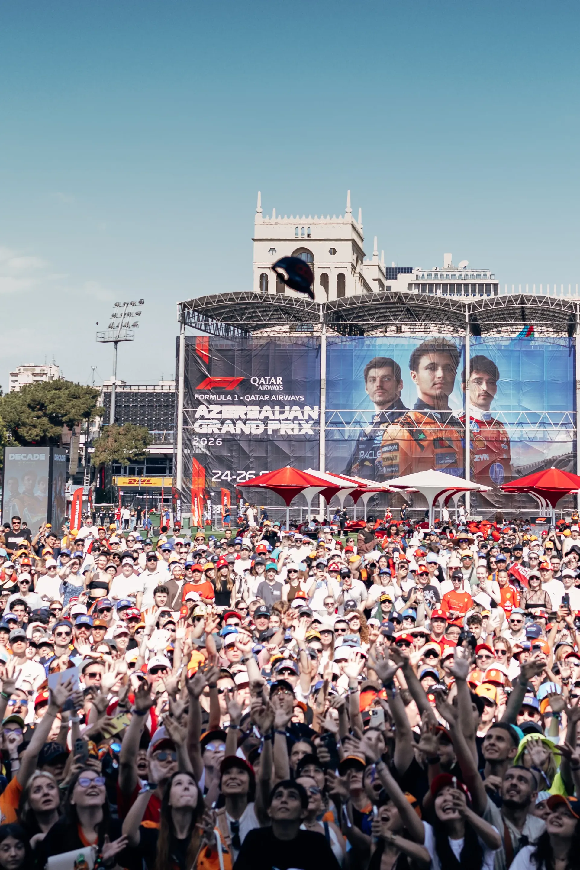 Fans gathered at the Azerbaijan Grand Prix with Formula 1® branding and the Audi Revolut F1® Team drivers displayed on a large screen