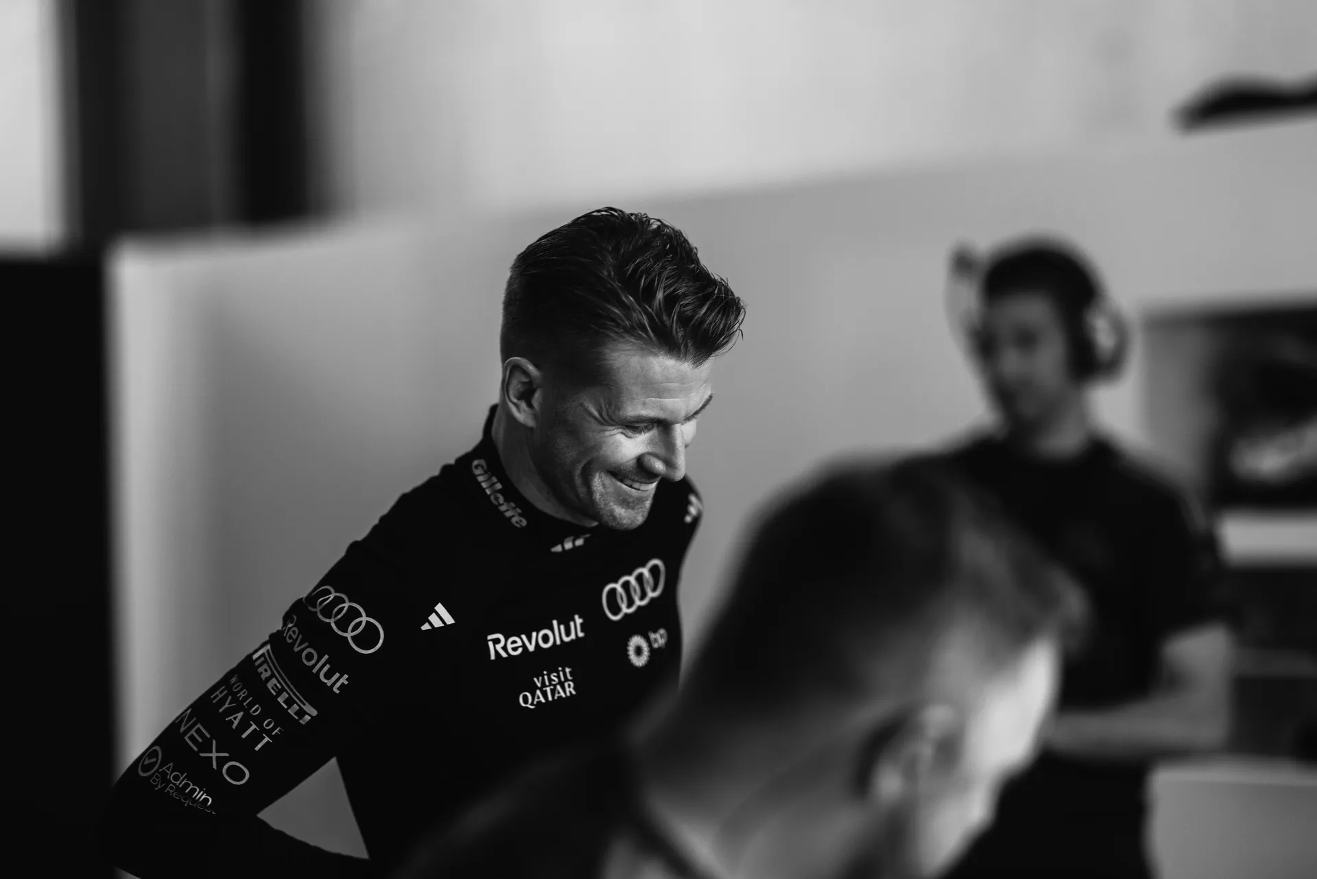 Black and white shot of Audi Revolut F1® Team driver Nico Hulkenberg in the garage during Free Practice 1 at the Azerbaijan Grand Prix