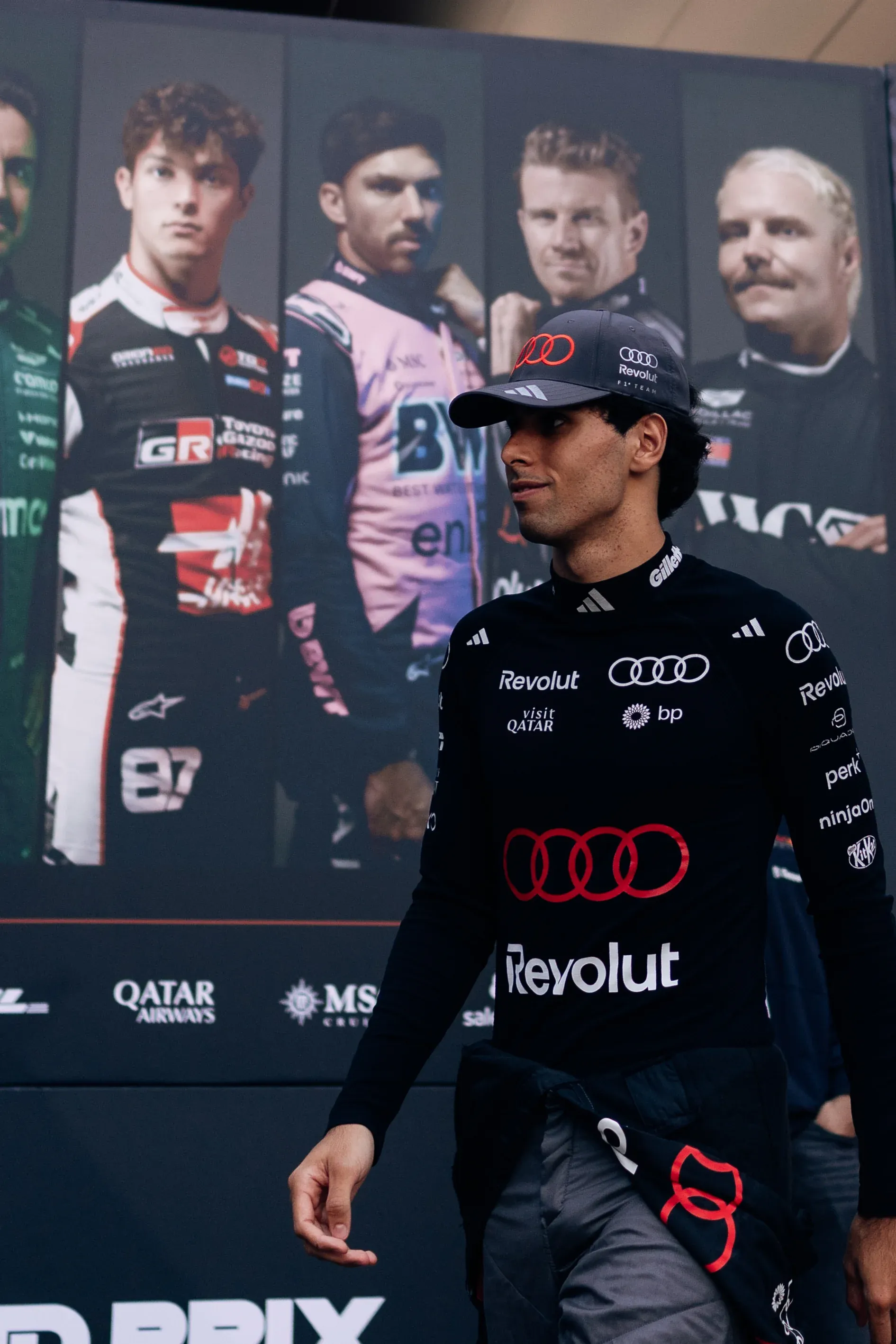 Audi Revolut F1® Team driver Gabriel Bortoleto walking through the paddock