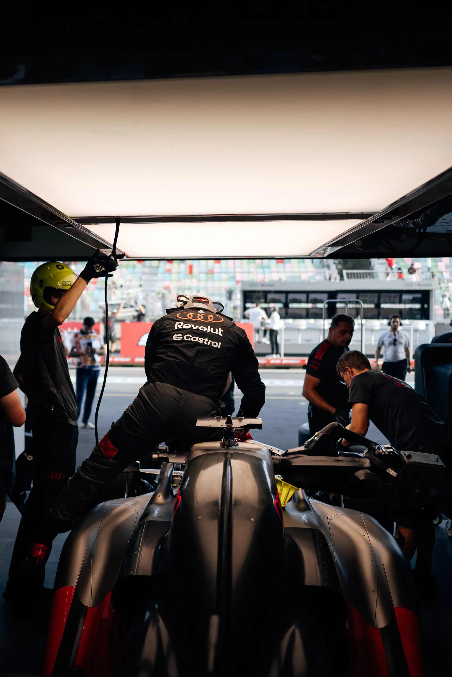 Audi Revolut F1® Team mechanic working on the Audi R26
