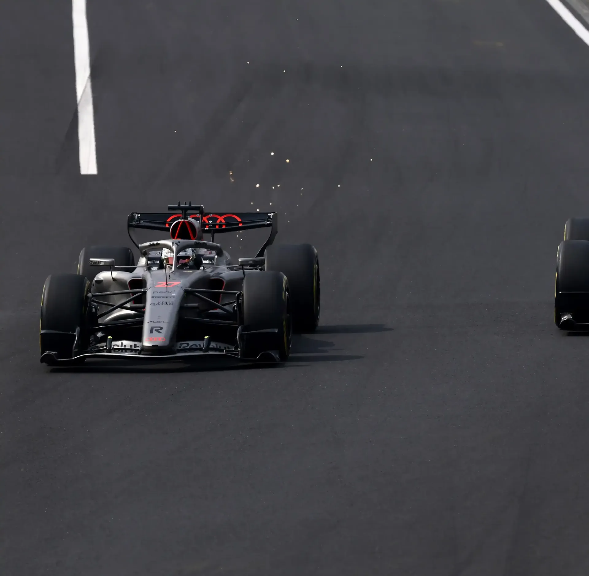 Audi Revolut F1® Team car overtaking on the racetrack