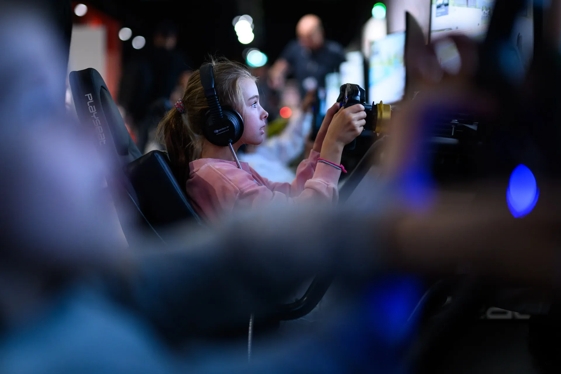 Visitor using a racing simulator during the Formula 1 exhibition experience