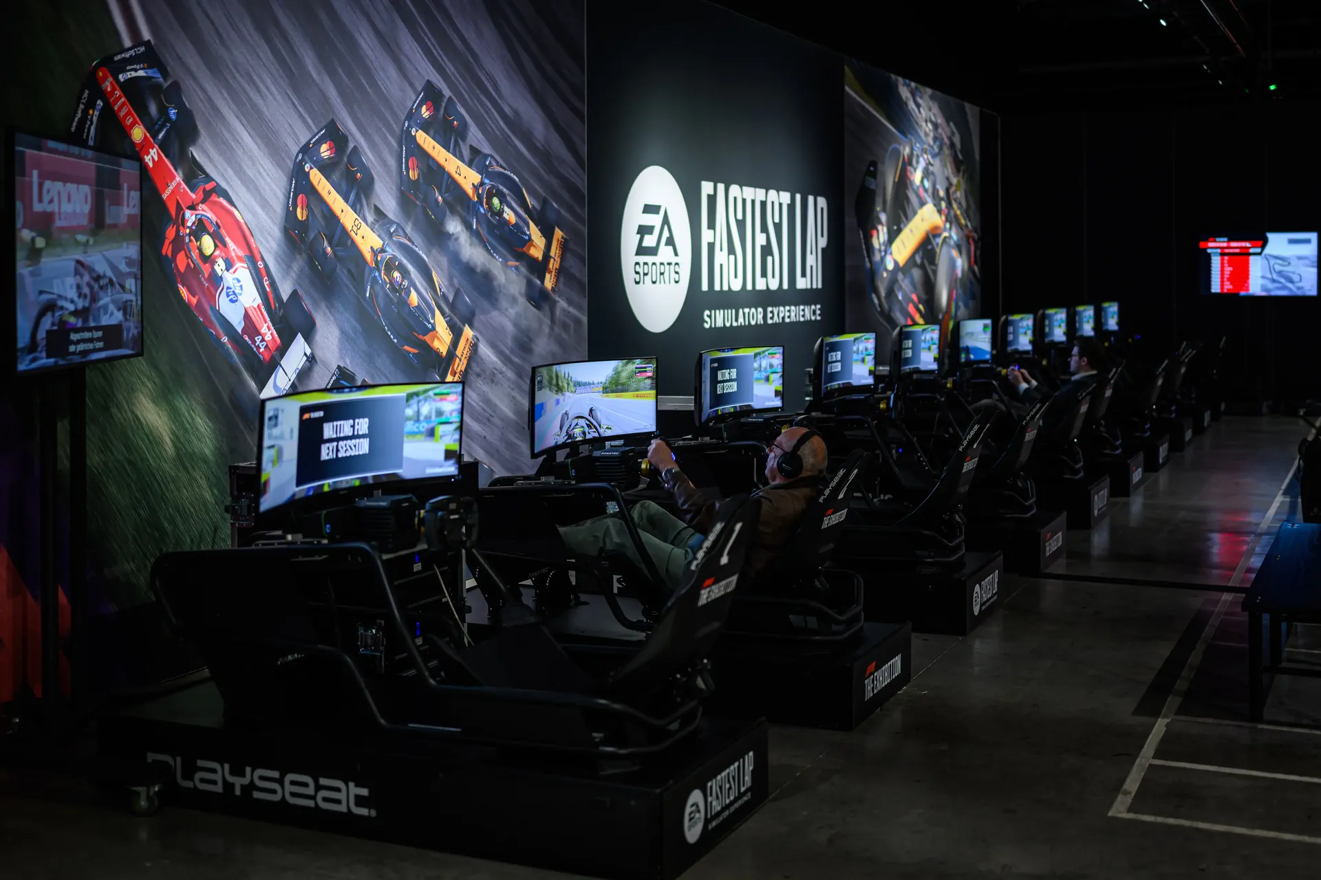 Formula 1 racing simulator area with immersive gaming and motorsport displays