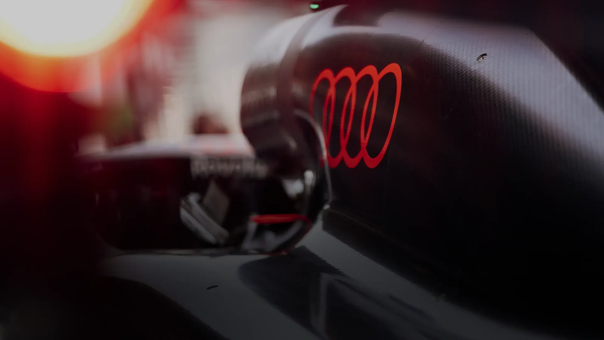 Rear close up side view of the Audi Revolute F1 Team R26 car in studio