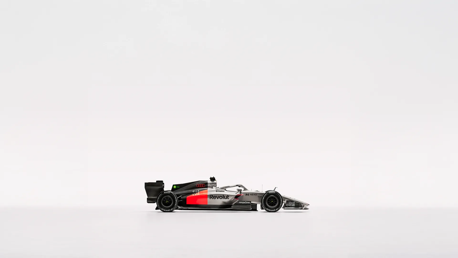 Side view of the Audi Revolute F1 Team R26 car in studio