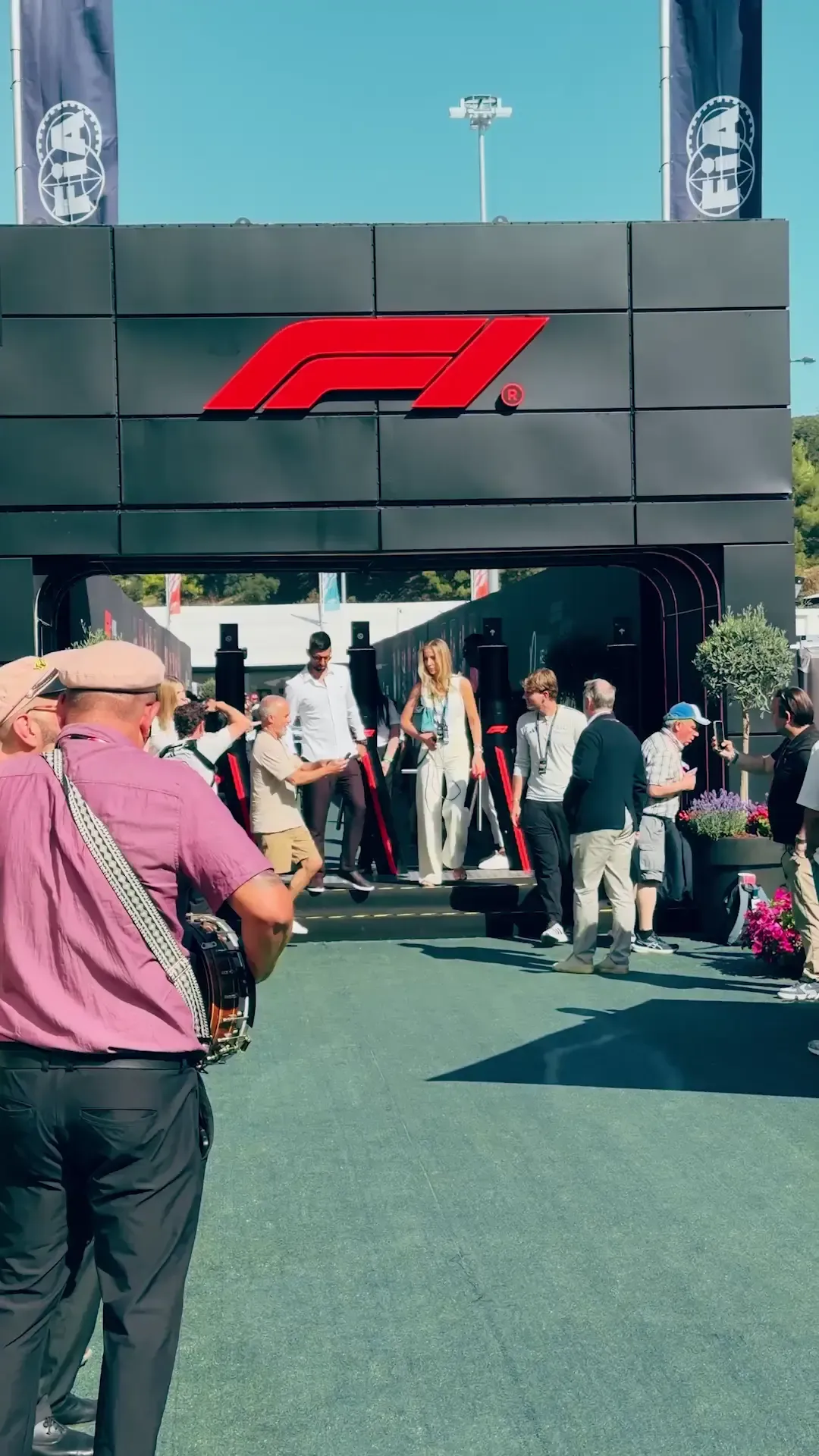 Novak Djokovic visiting the Audi Revolut F1® Team paddock and garage, interacting with drivers and team members during the Barcelona Grand Prix weekend