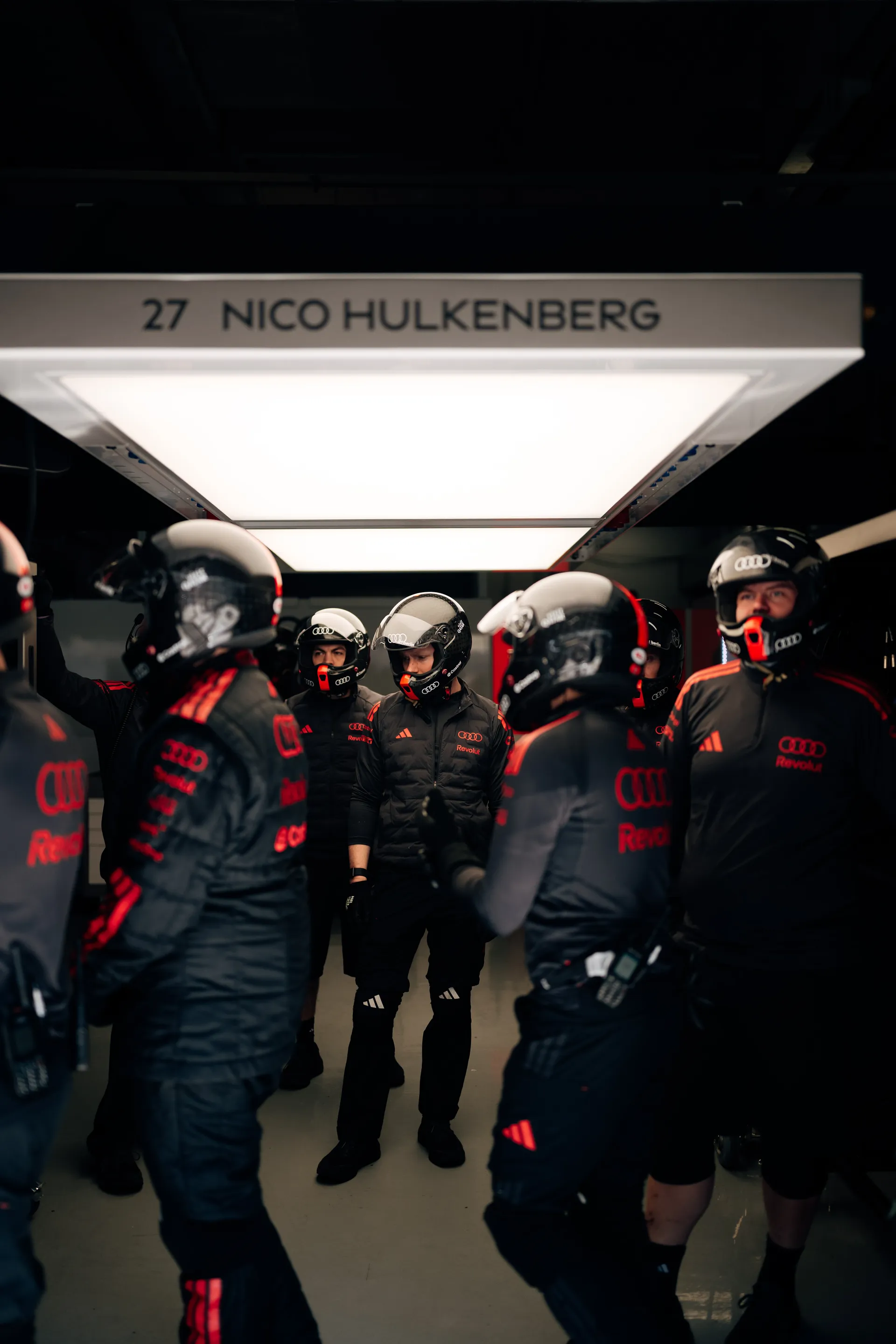 Audi Revolut F1® Team pit crew gather in Nico Hulkenberg’s pit bay wearing helmets before a practice stop in Shanghai.