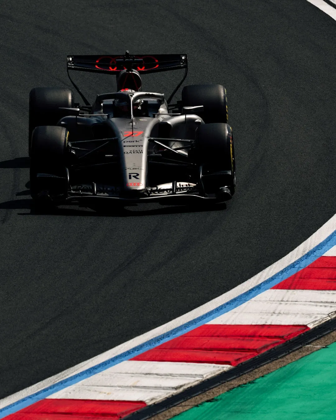 Overhead view of Nico Hulkenberg’s Audi Revolut F1® Team car turning through a corner at the Chinese Grand Prix.