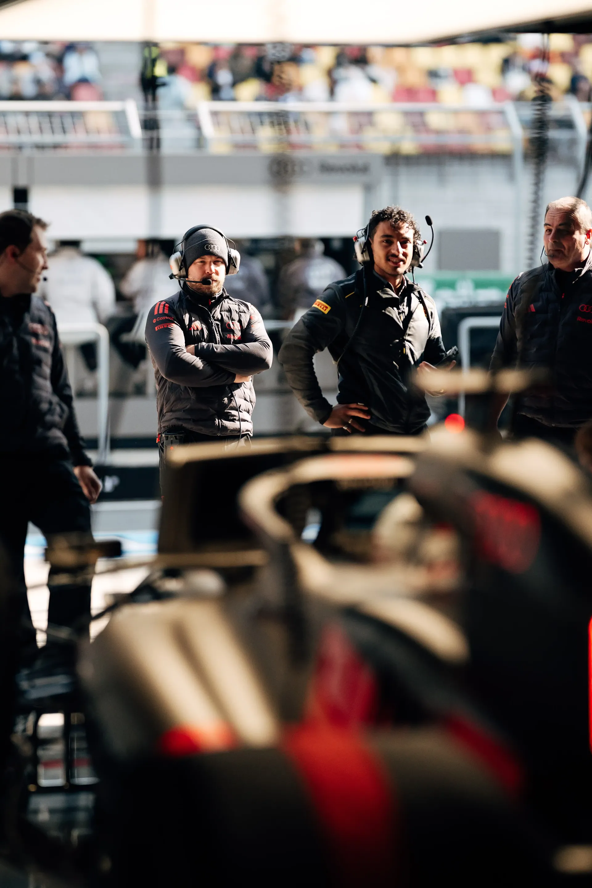 Audi Revolut F1® Team crew members observing the garage activity during the Formula 1 practice session.