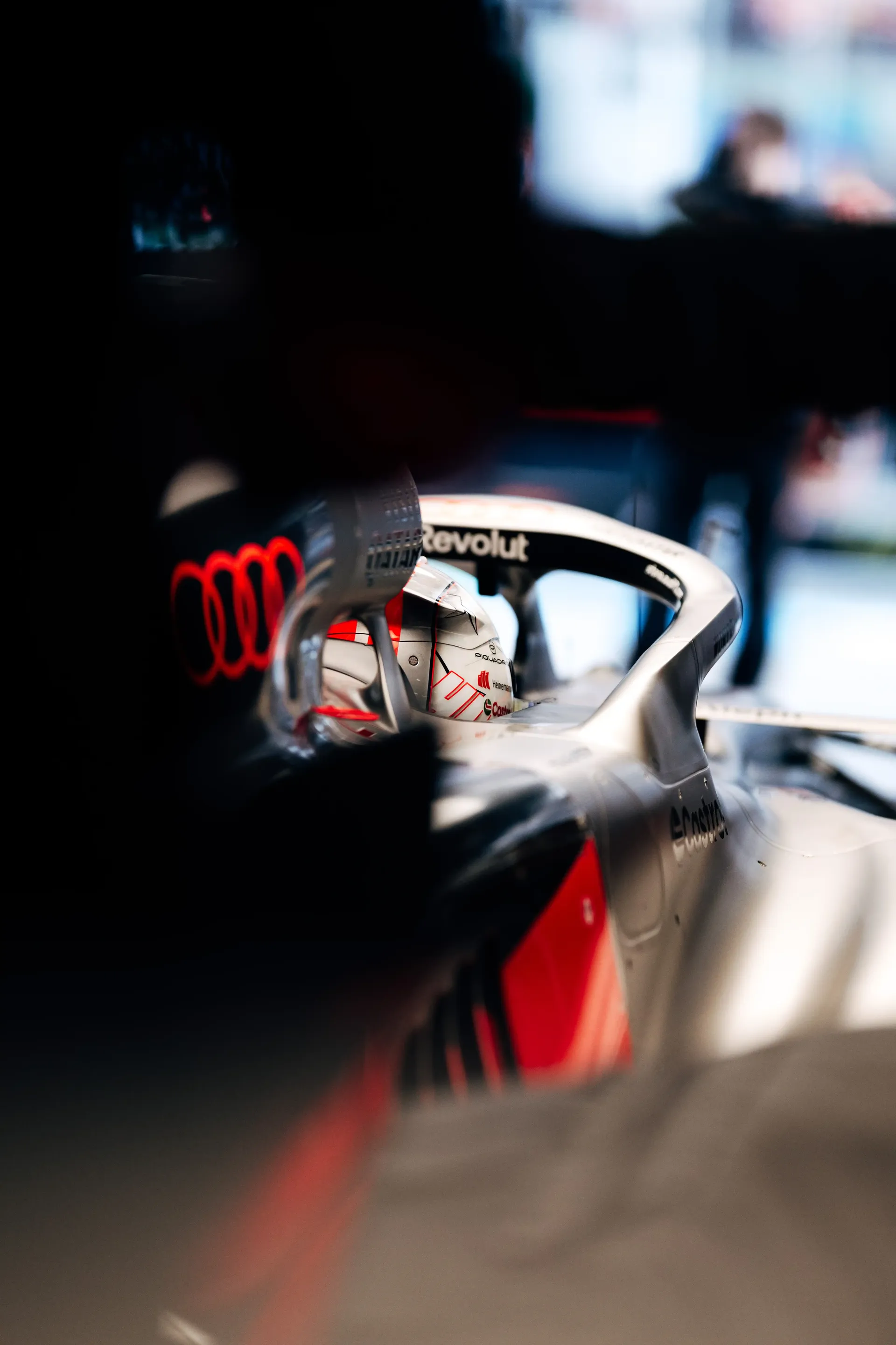 Close-up detail of the rear section of the Audi Revolut F1® Team Formula 1 car inside the garage.